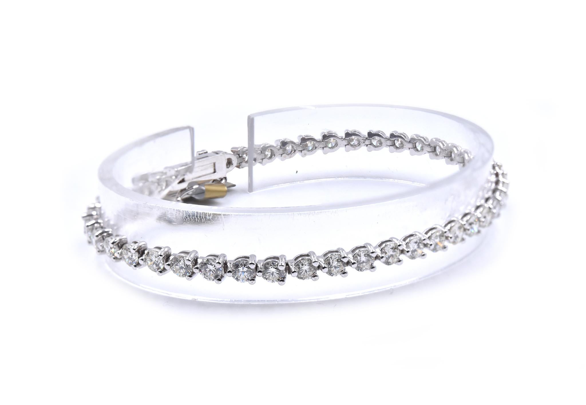 Material: 14K white gold
Diamonds: 47 round brilliant cut = 5.19cttw
Color: H
Clarity: SI1
Dimensions: bracelet will fit up to a 7 -inch wrist
Weight: 9.27 grams
