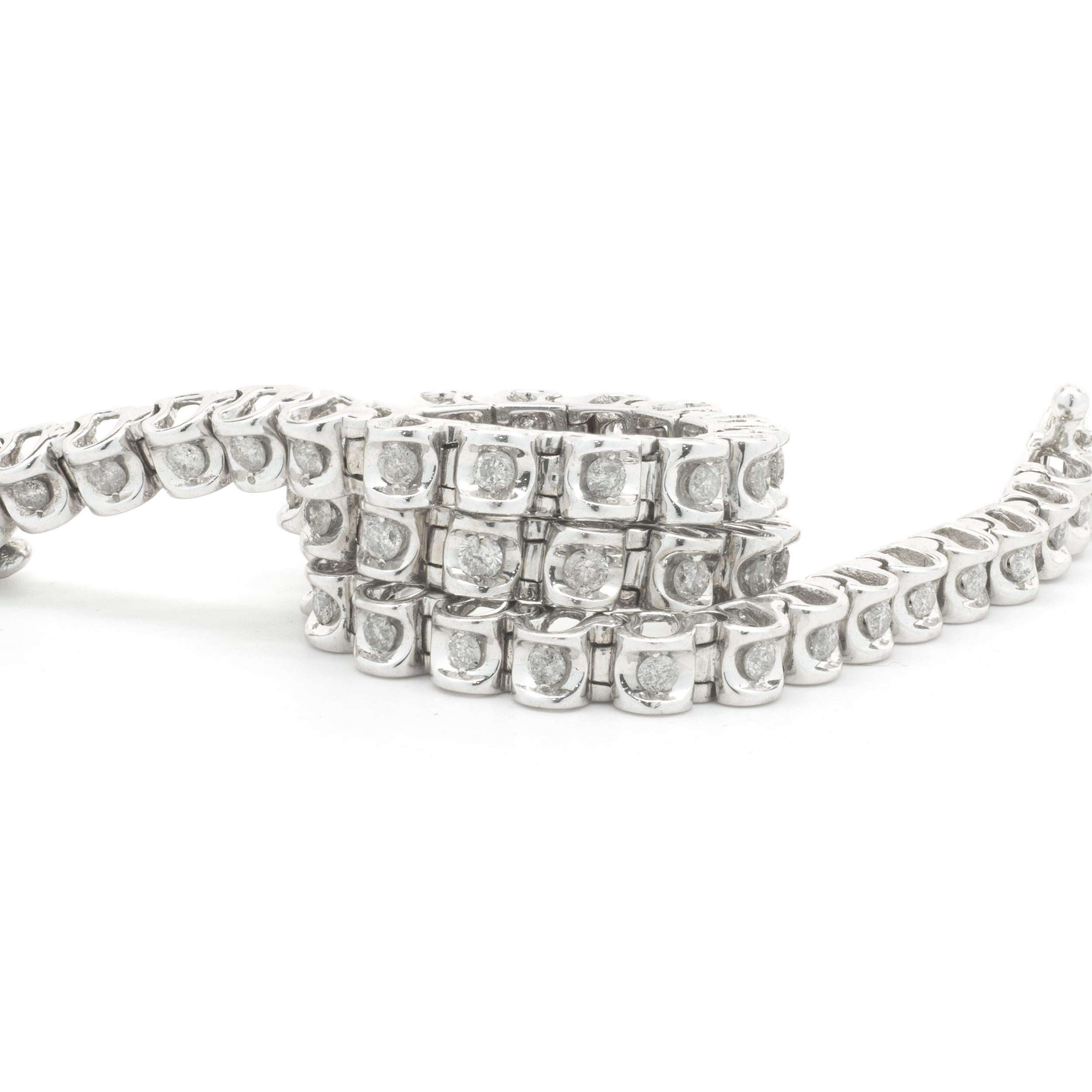 Designer: custom
Material: 14K white gold
Diamonds: 49 round cut = 1.00cttw
Color: I
Clarity: I1
Dimensions: bracelet measures 7.25-inches long  
Weight: 11.69 grams
