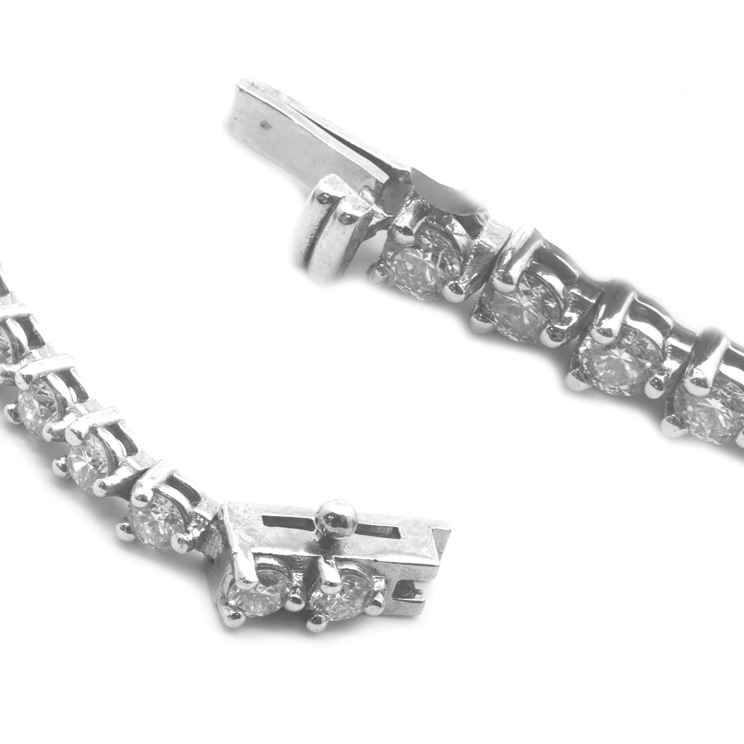 Material: 14K white gold
Diamonds: 53 round brilliant cut = 3.32cttw
Color: H
Clarity: SI1
Dimensions: bracelet will fit up to a 7 -inch wrist
Weight: 8.23 grams
