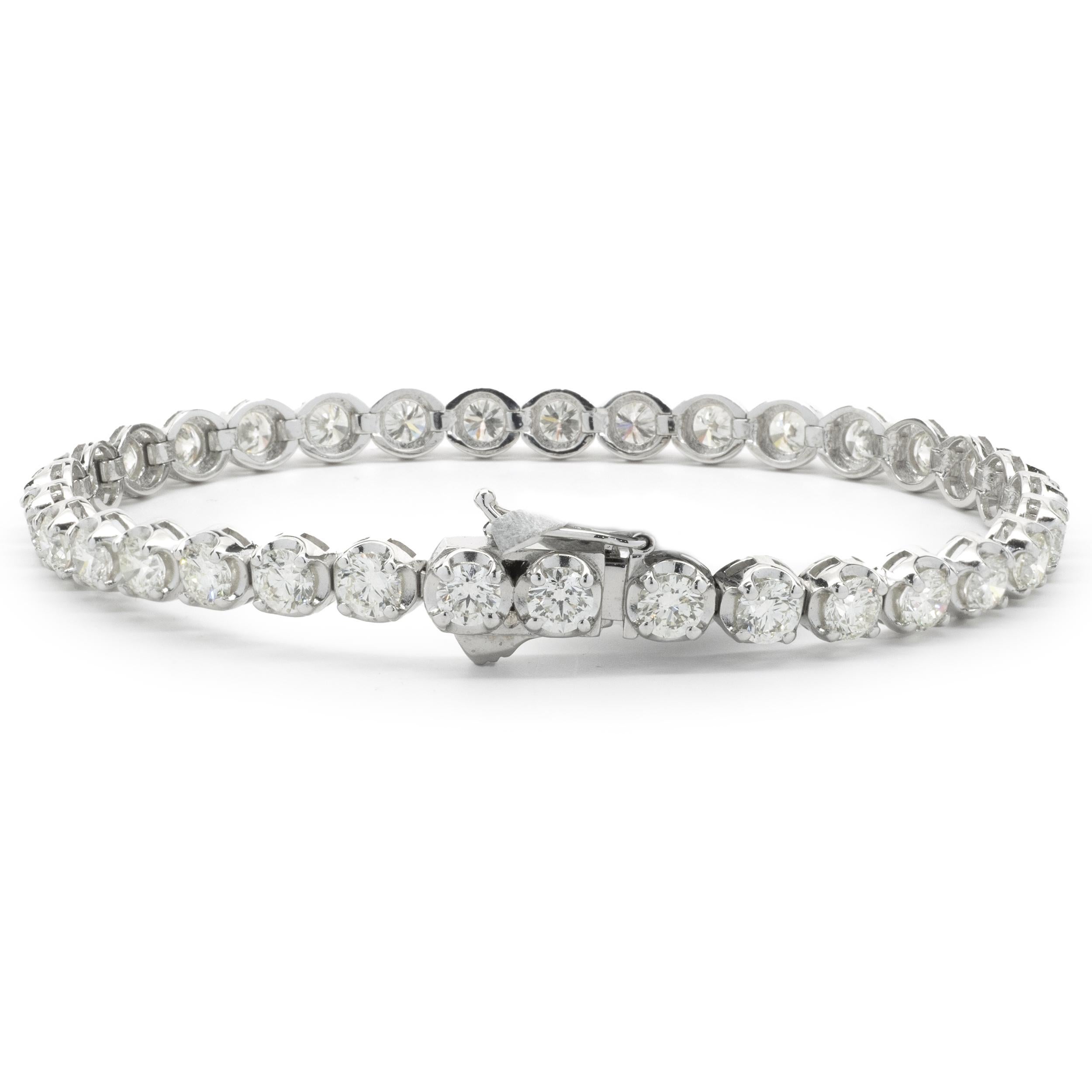 Designer: custom
Material: 14K white gold
Diamond: 33 round brilliant cut = 8.45cttw
Color: G/H
Clarity: VS2
Dimensions: bracelet will fit up to a 7-inch wrist
Weight: 13.78 grams