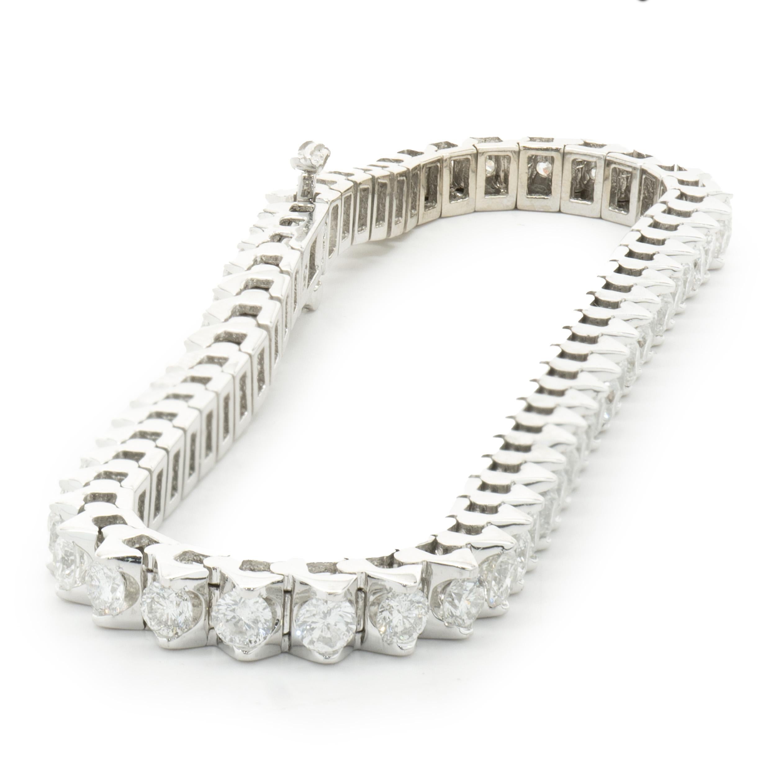 Designer: custom design
Material: 14K white gold
Diamond: 56 round brilliant = 5.00cttw
Color: H
Clarity: SI2
Dimensions: bracelet will fit up to a 6.75-inch wrist
Weight: 17.89 grams
