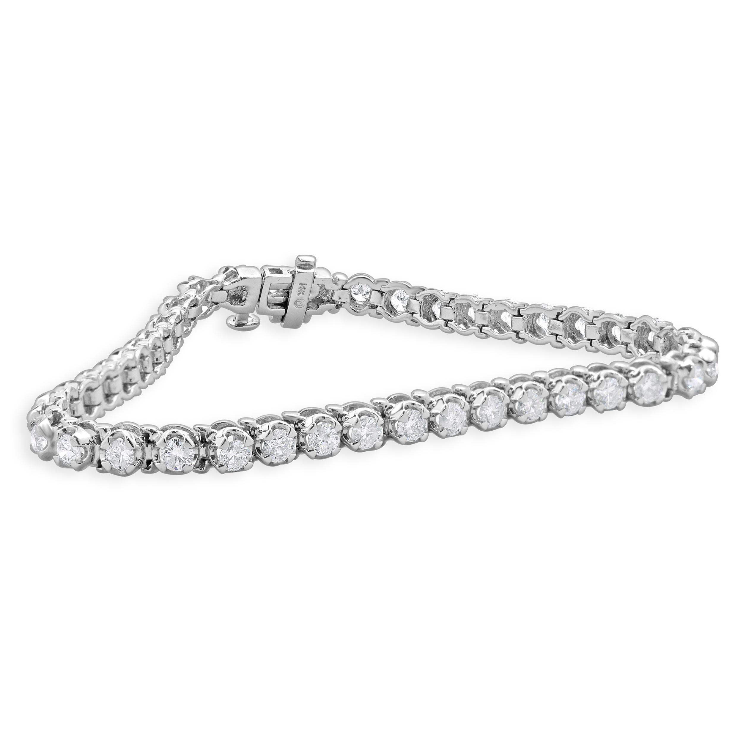 Designer: custom design
Material: 14K white gold
Diamond: 42 round brilliant cut = 2.95cttw
Color: J
Clarity: SI3
Dimensions: bracelet will fit up to a 6.5-inch wrist
Weight: 8.93 grams
