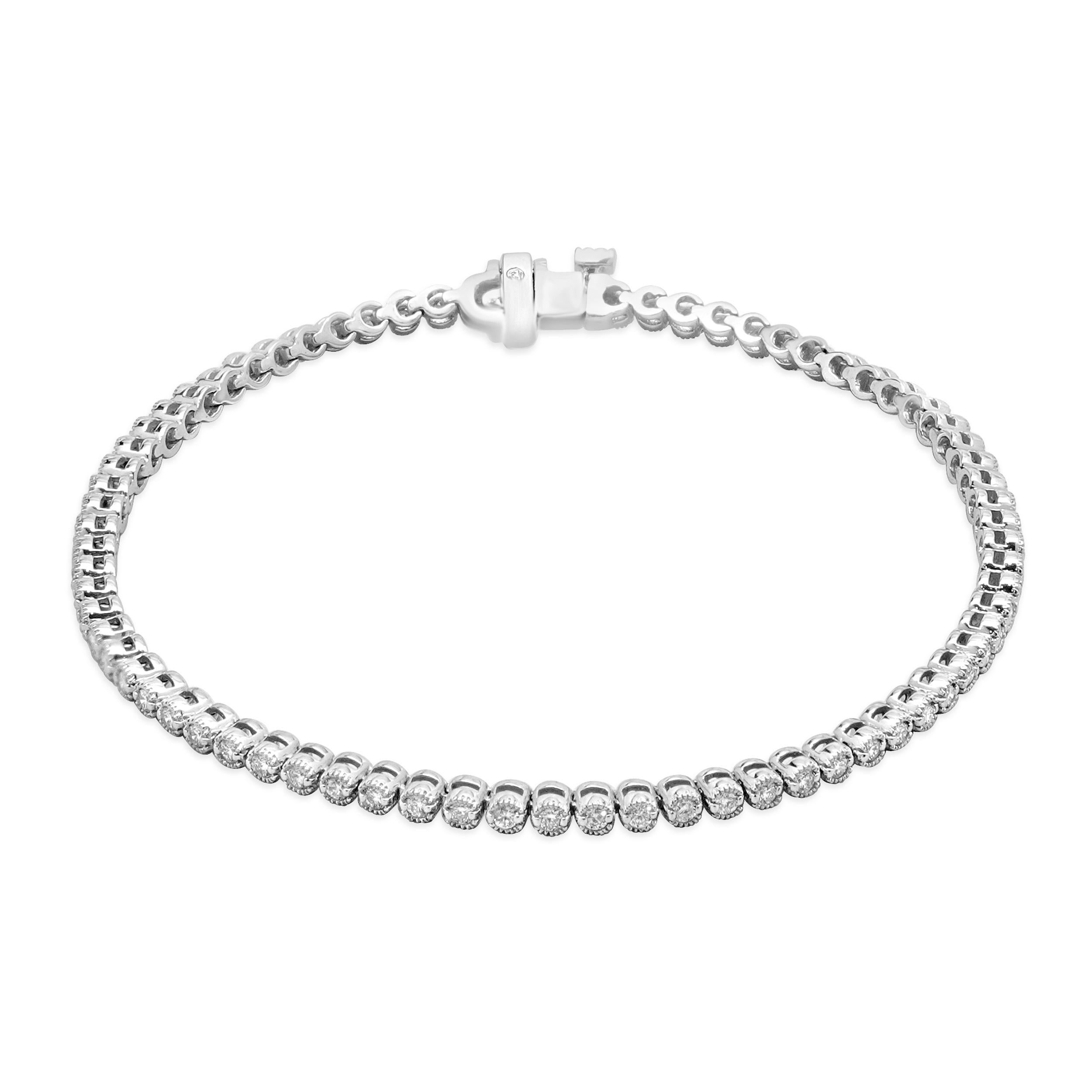 Designer: custom design
Material: 14K white gold
Diamond: 72 round brilliant cut = 1.00cttw
Color: G/H
Clarity: VS-SI1
Dimensions: bracelet will fit up to a 7-inch wrist
Weight: 7.03 grams

