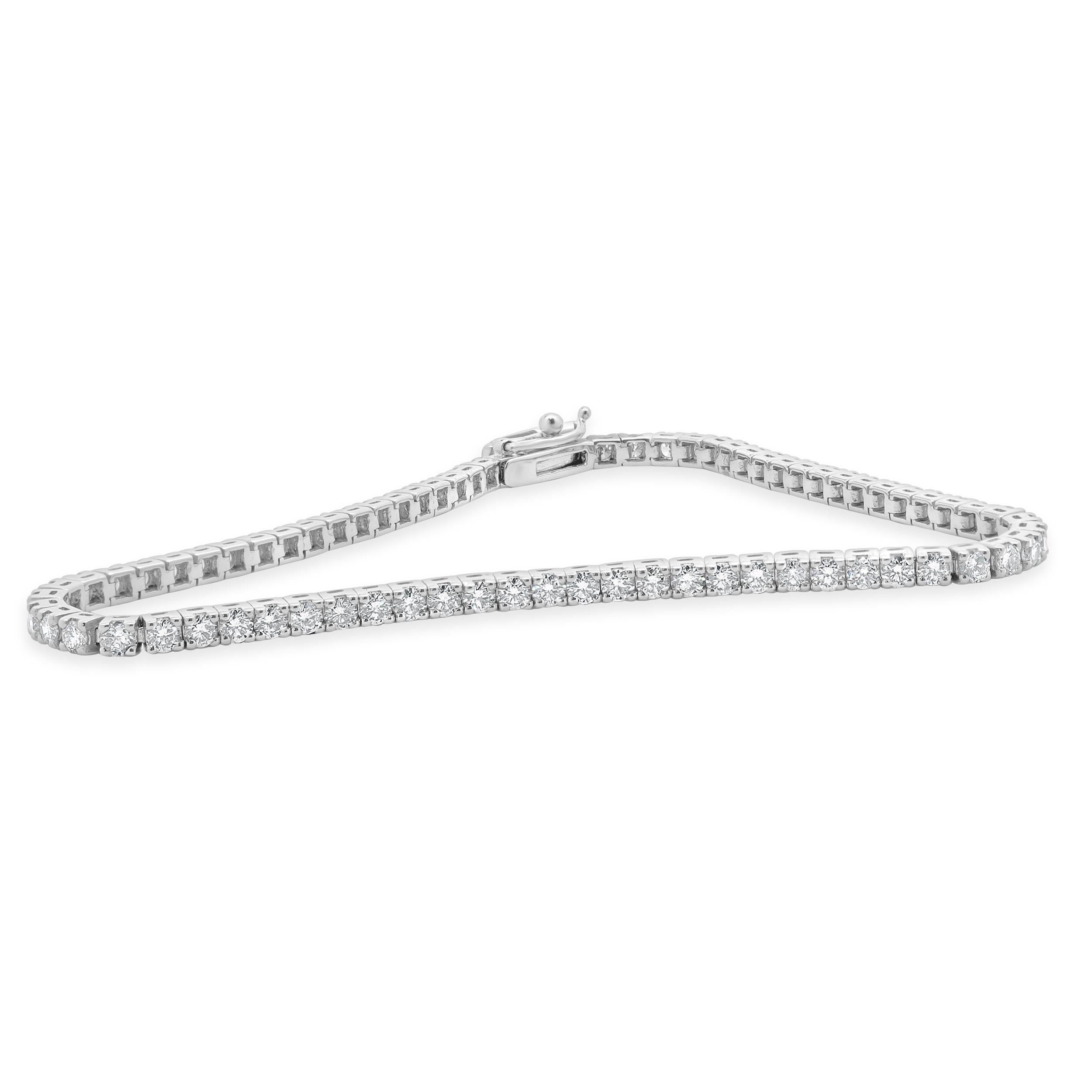 Designer: custom
Material: 14K white gold
Diamond: 70 round brilliant cut = 2.96cttw
Color: H
Clarity: SI1-2
Dimensions: bracelet will fit up to a 7-inch wrist
Weight: 7.60 grams