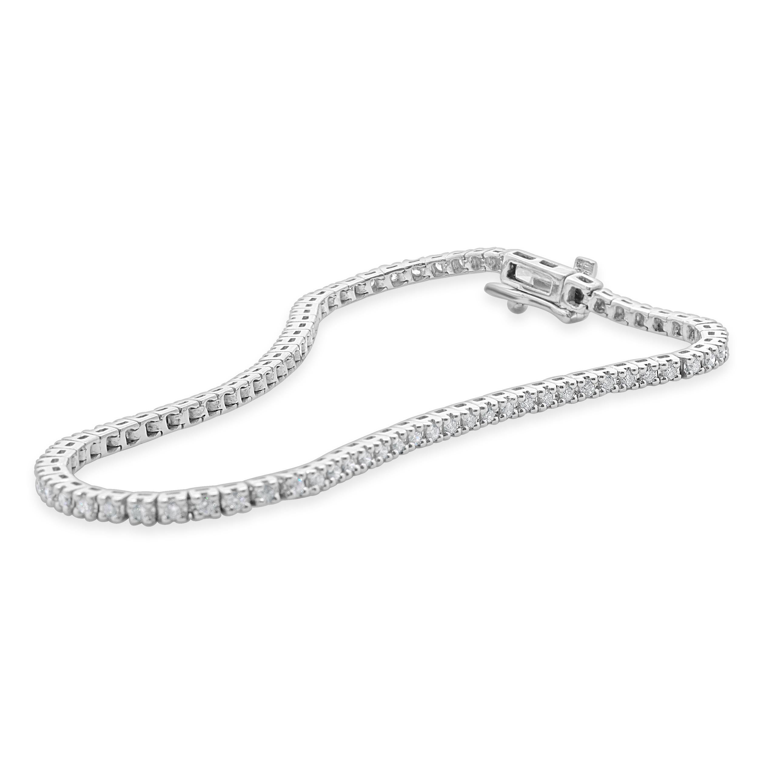 Designer: custom
Material: 14K white gold
Diamond: 79 round brilliant cut = 0.94cttw
Color: G
Clarity: SI1-2
Dimensions: bracelet will fit up to a 7-inch wrist
Weight: 7.30 grams