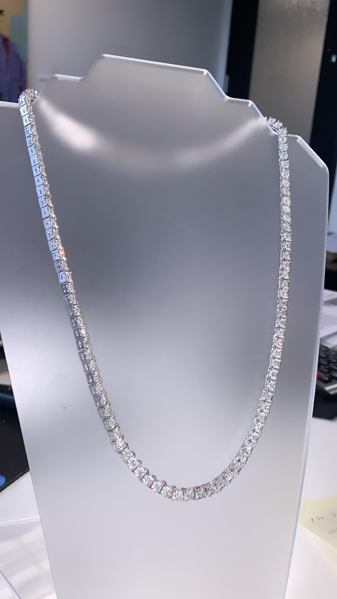 Bring the elegance of your style with this stunning diamond  tennis necklace. This piece has 113 pieces of diamonds in 10 carat total weight, F/G color and VS1 in clarity, crafted in 14k white gold. Specifications: main stone: ROUND CUT DIAMOND