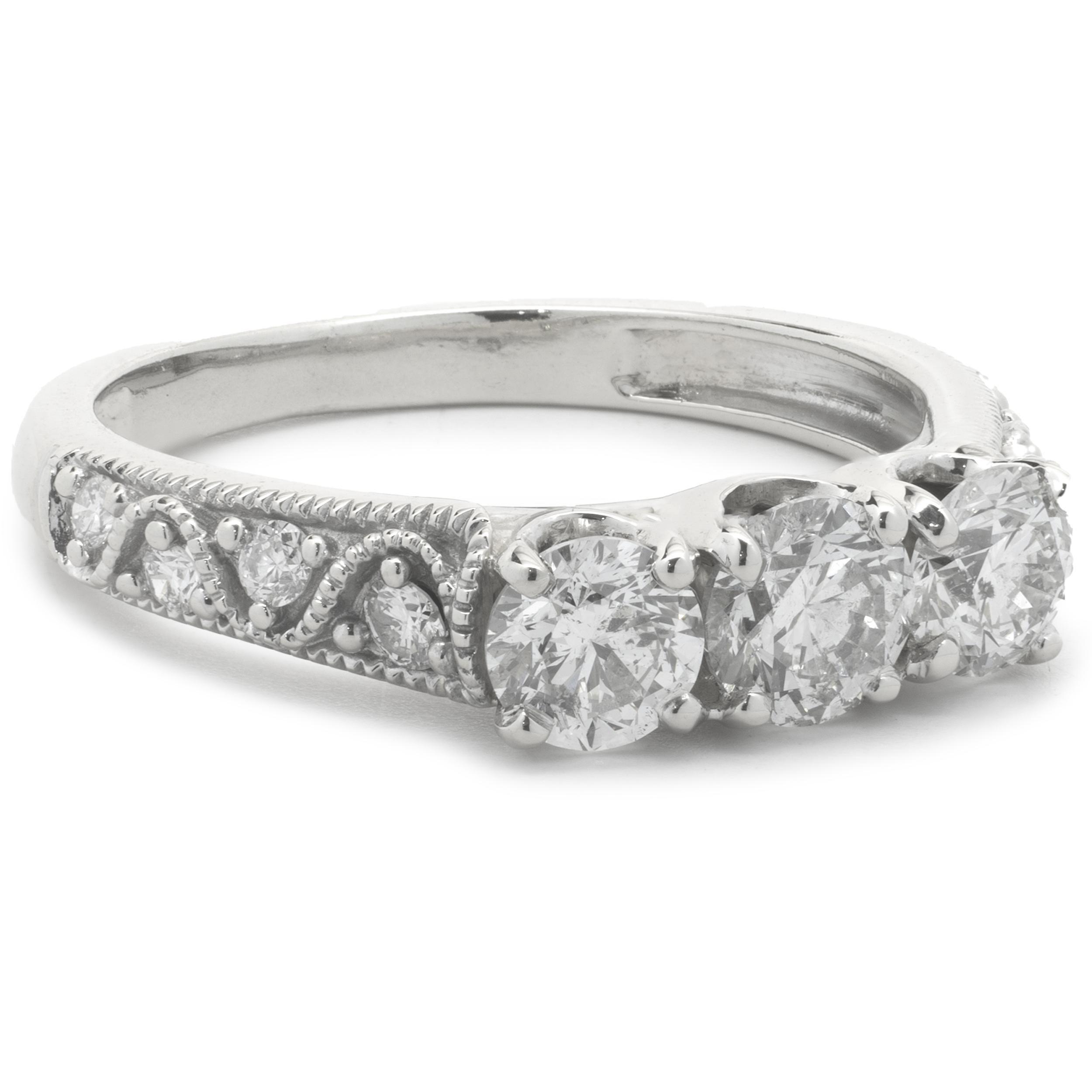 Designer: Custom
Material: 14K white gold
Diamonds: 11 round brilliant cut = 1.07cttw
Color: G
Clarity: SI1-2
Size: 6.5 complimentary sizing available 
Dimensions: ring measures 4.50mm in width
Weight: 3.72 grams
