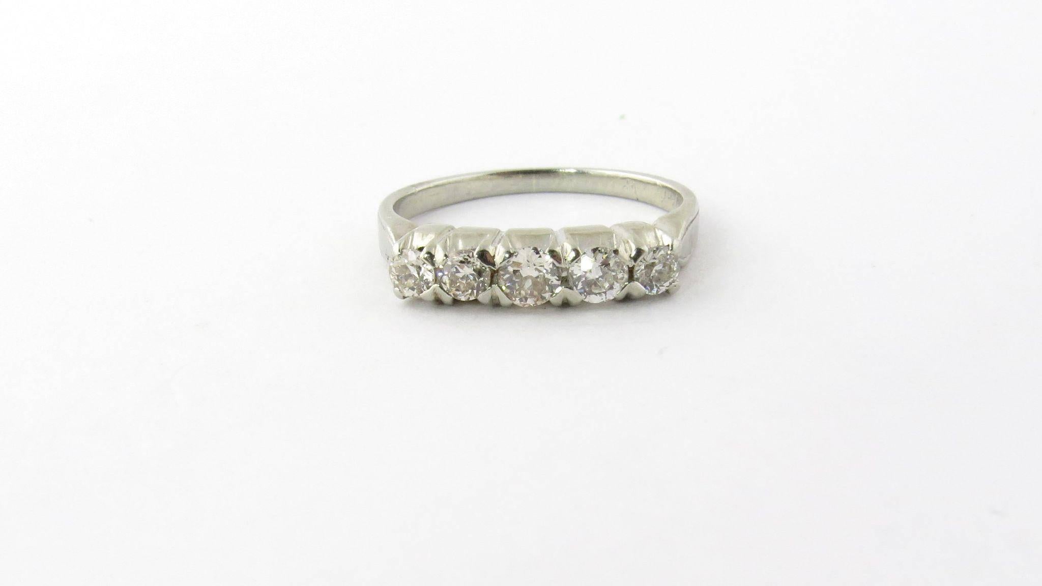 Vintage 14K White Gold Diamond Wedding Band Size 4 

This wedding band is set with 5 European cut diamonds - lots of sparkle! 

Diamonds total approximately .40 carats 

SI clarity, J-k clarity 

Front of ring is 14 mm x 3 mm 

Back of shank is 1 mm