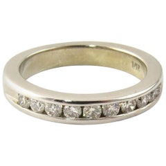 Alliance en or blanc 14 carats avec diamant