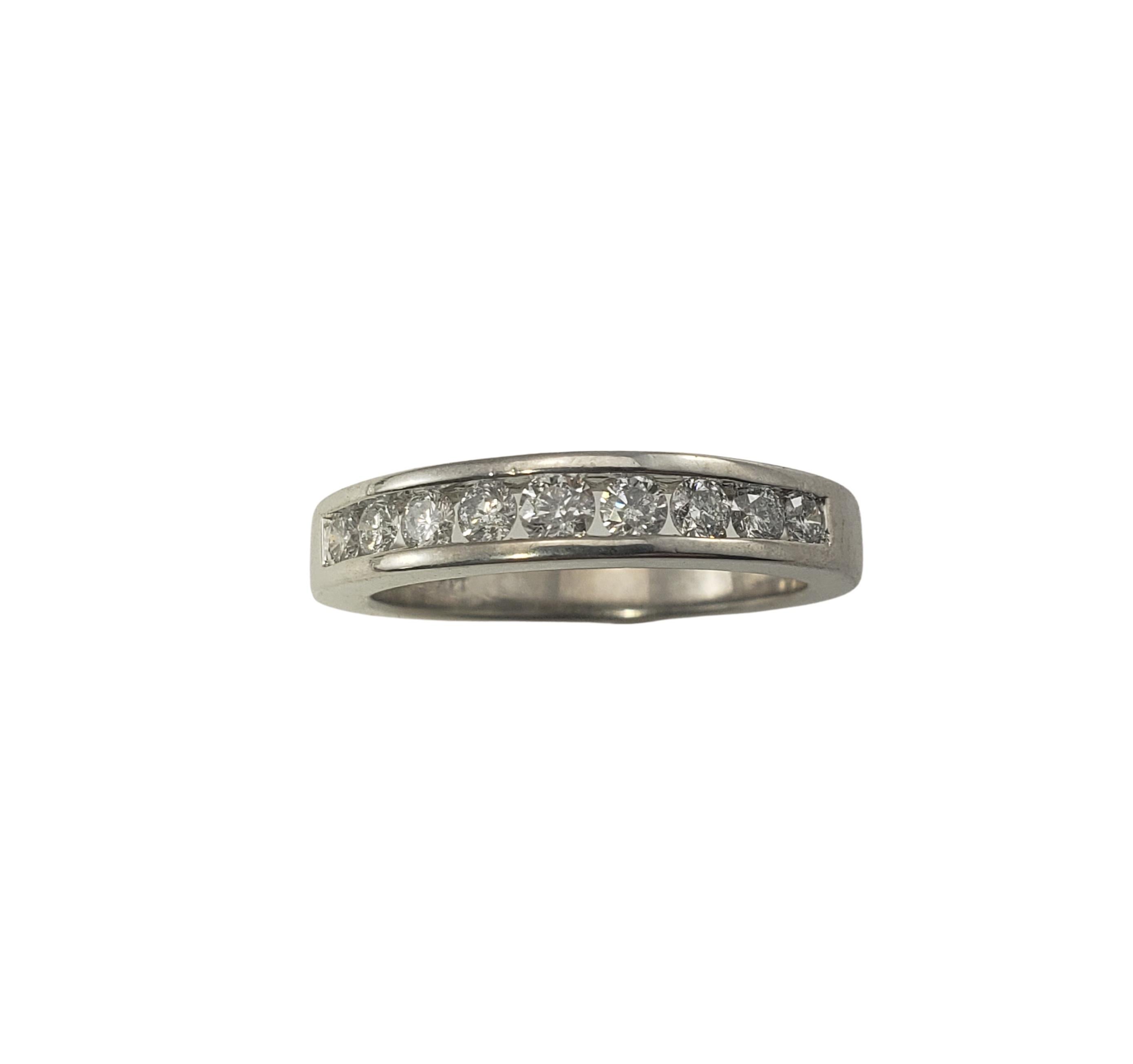 14 Karat White Gold Diamond Wedding Band Ring Size 7.25-

This sparkling ring features nine round brilliant cut diamonds set in classic 14K white gold.  Width:  4 mm.  Shank:  3 mm.

Approximate total diamond weight:  .31 ct.

Diamond color: