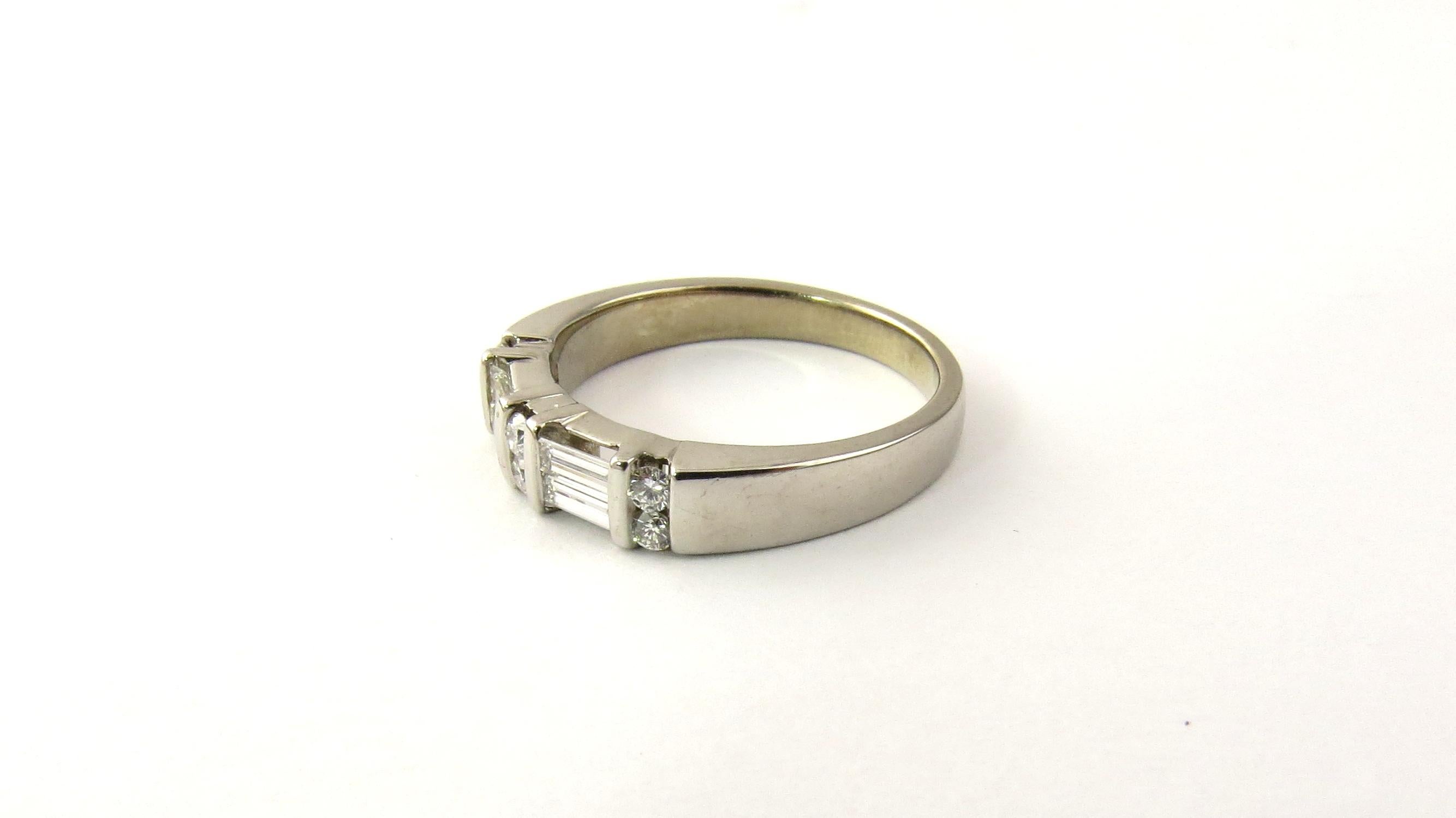 Vintage 14 Karat White Gold Diamond Wedding Band Size 6

This sparkling ring features six round brilliant cut diamonds (.02 ct. each) and four baguette diamonds (.10 ct. each) set in classic 14K white gold. Shank: 2.5 mm. Width: 5 mm.

Approximate