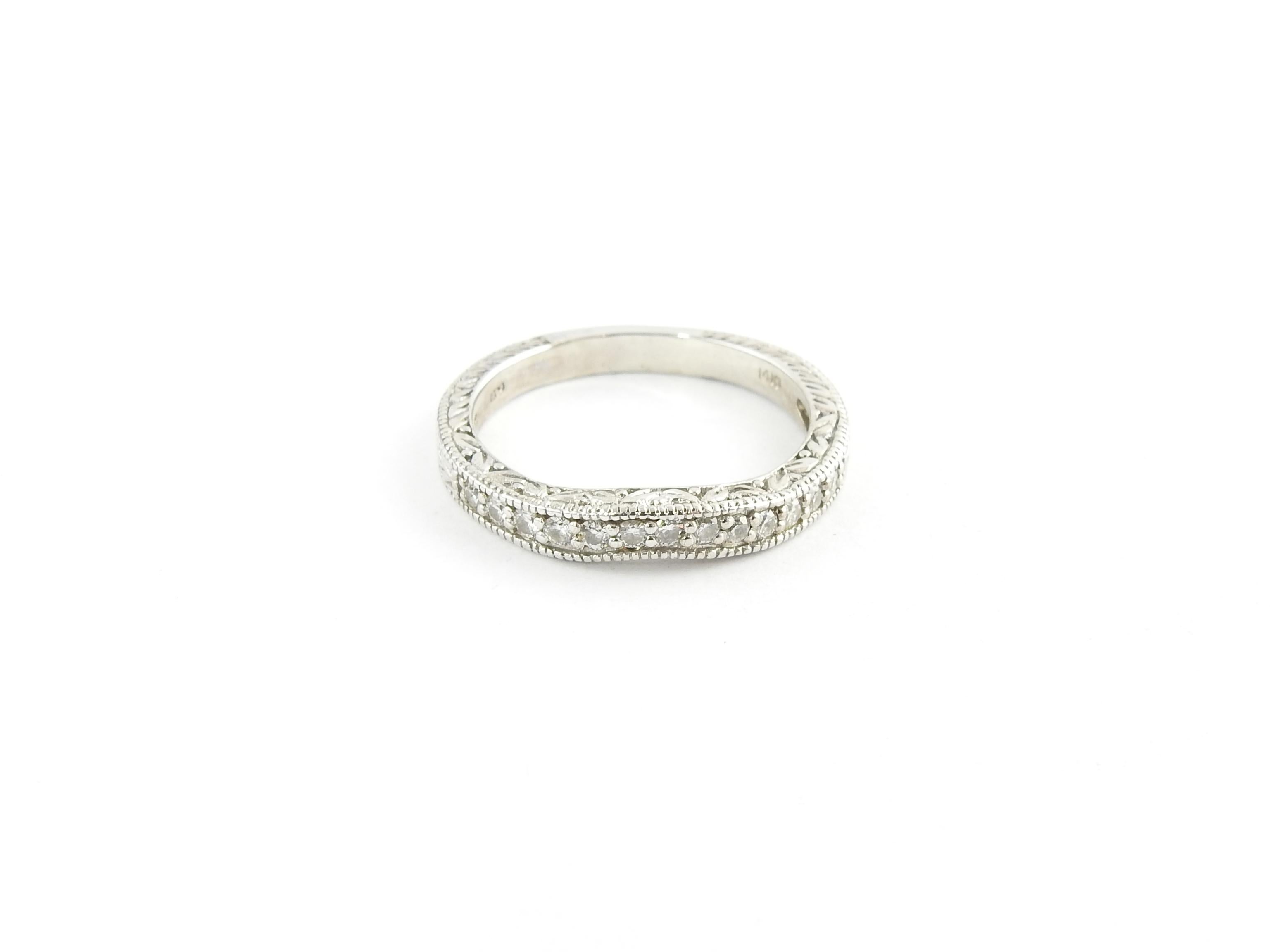 Vintage 14 Karat White Gold Diamond Wedding Band Size 7.5

This sparkling wedding band features 13 round brilliant cut diamonds set in a stunning curved design. Set in beautifully detailed 14K white gold.

Width: 3 mm. Shank: 2.5 mm.

Approximate