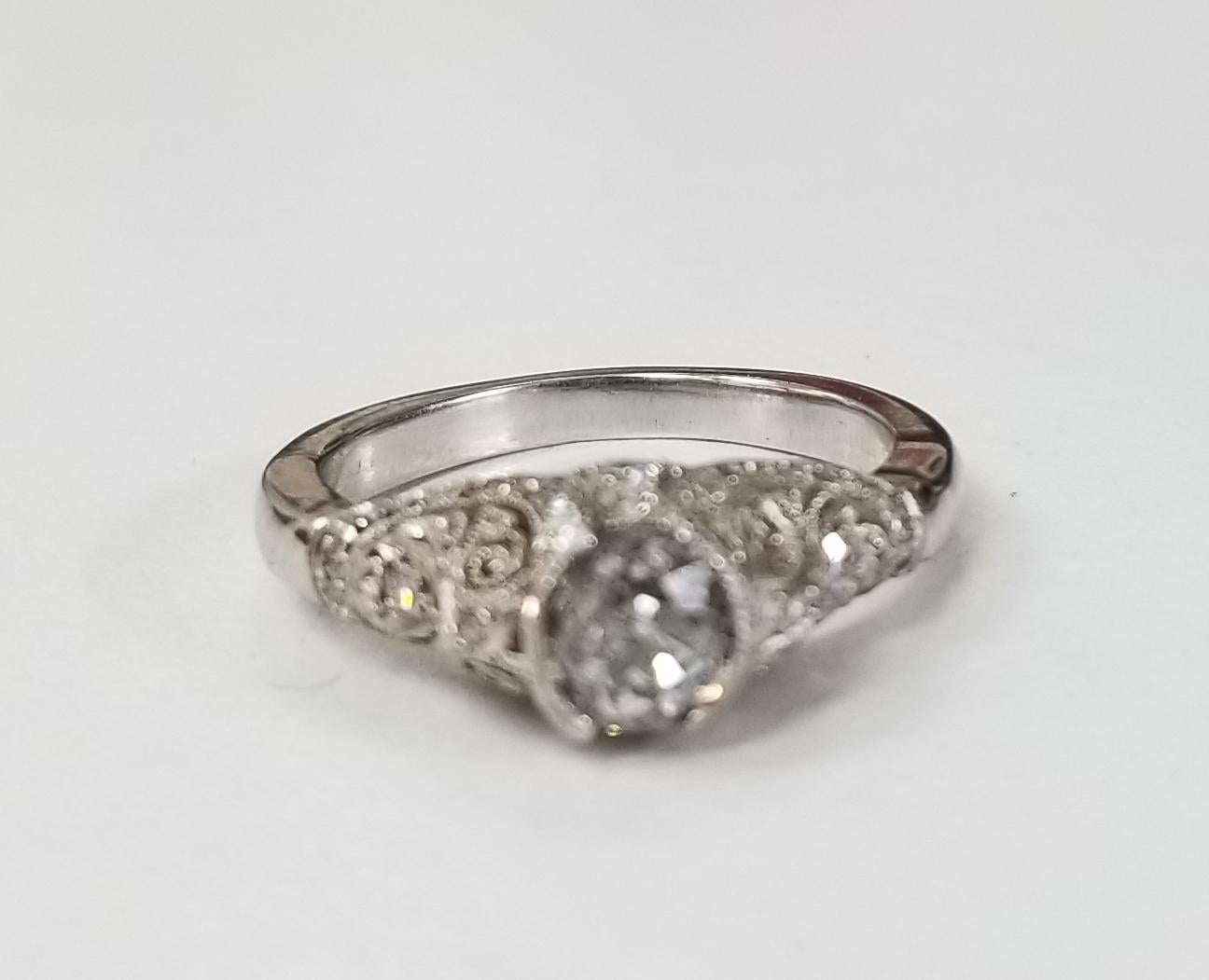 14 karat white gold diamond wedding vintage looking ring, containing 1 round old 