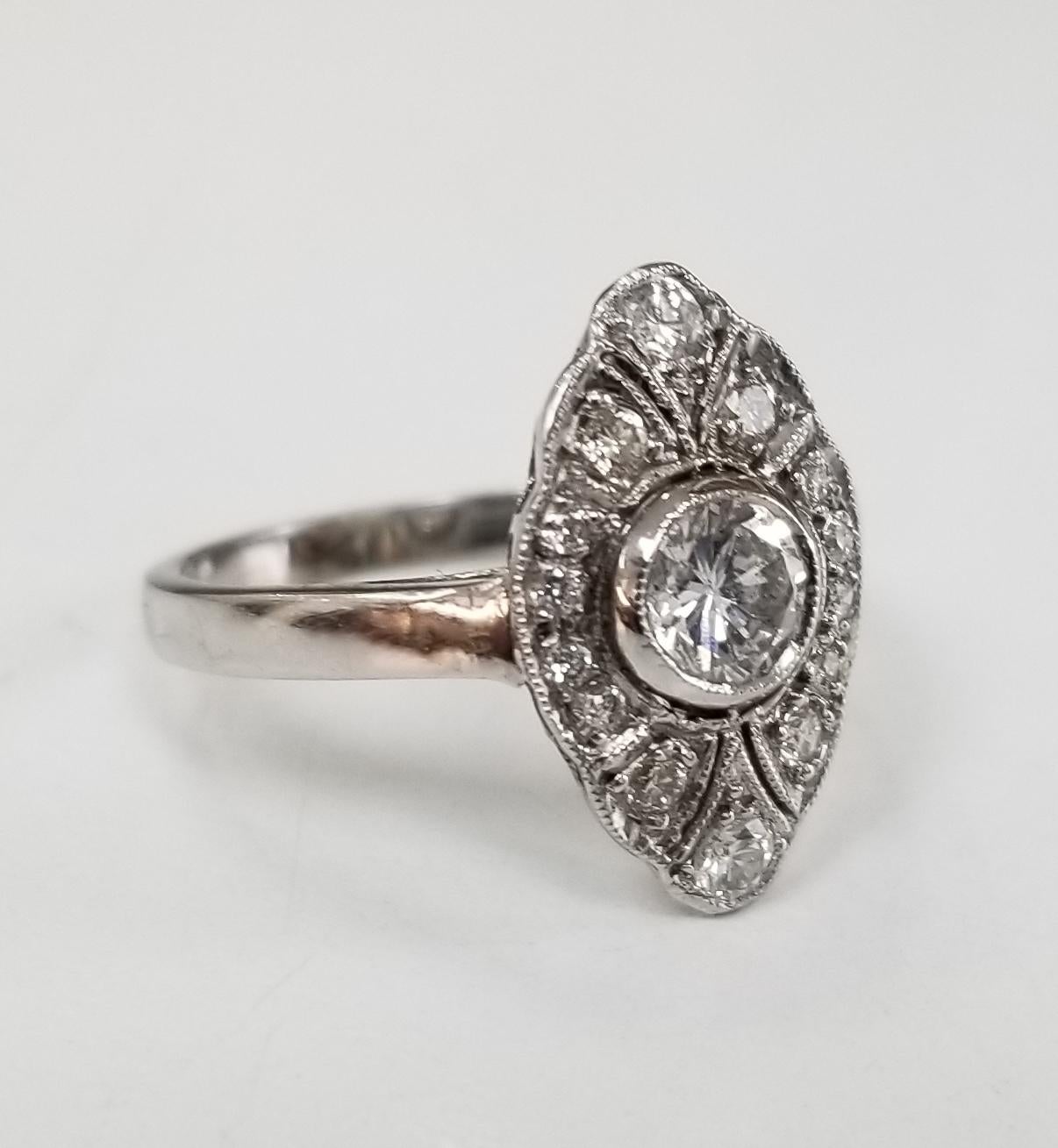14 karat white gold diamond wedding vintage looking ring, containing 1 brilliant cut diamond weighing .32pts. and 14 full cut diamonds weighing .26tps.  This ring is a size 5.5 but we will size to fit for free.