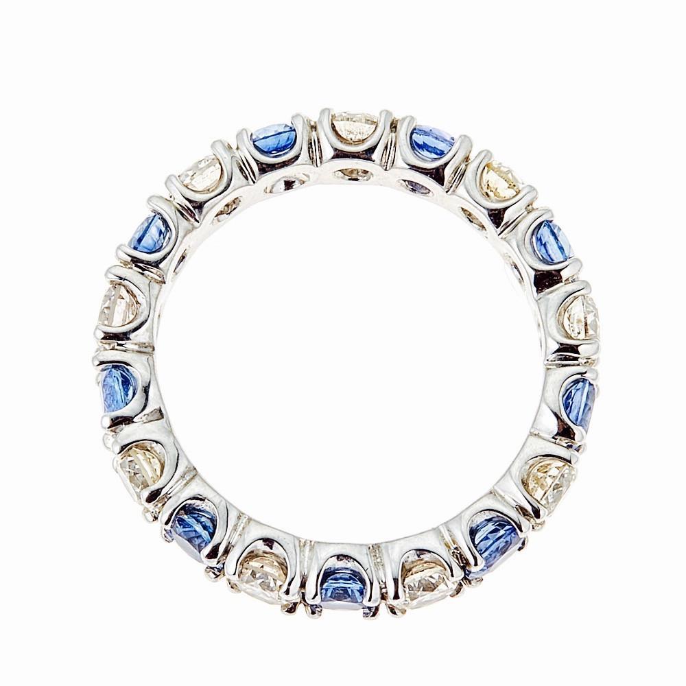 14 Karat White Gold Round Diamond and Sapphires Eternity Band Ring Size 6.5

Want to say someone thta you love them forever, for eternity? Do it with this exquisite sapphire and diamond ring. 1.60 ctw of Light blue sapphires and 1.36 ctw of Round
