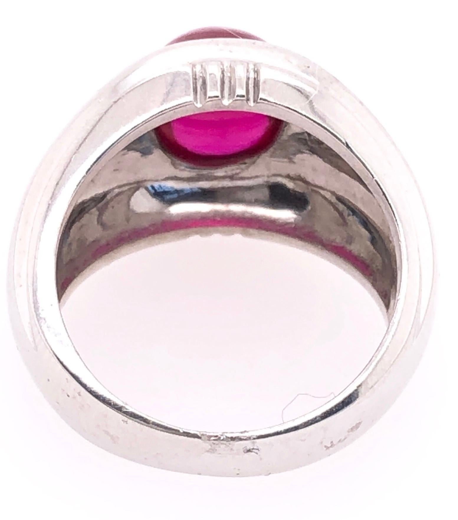14 Karat White Gold Dome Ring With Garnet Cabochon And Diamond Accents
0.25 total diamond weight.
Size 6.25
11.95 grams total weight.