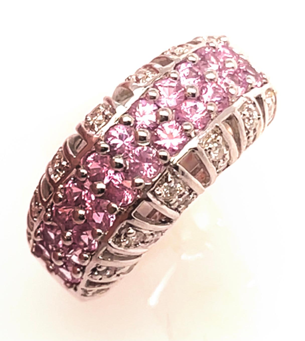 14 Karat White Gold Dome Ring With Pink Sapphires And Diamonds.
26 round diamonds 1.00 total diamond weight.
24 round pink sapphire
Size 6.5
7.39 gram total weight.