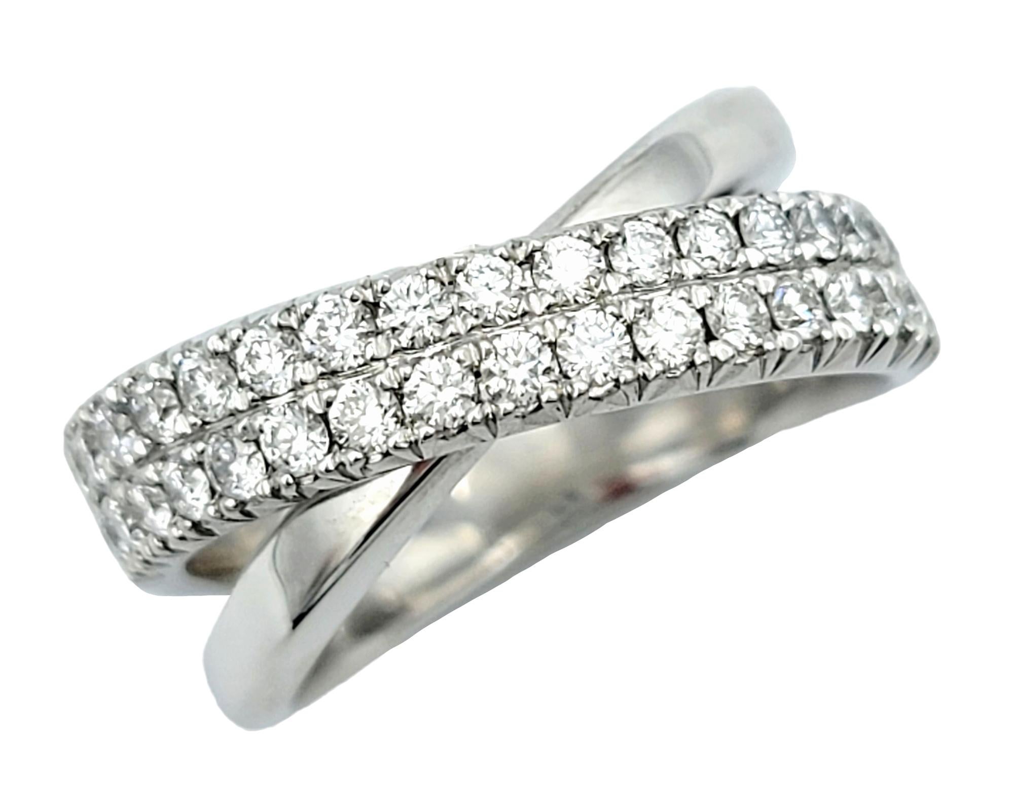 Ring size: 6

This exquisite 14 karat white gold crisscross ring is a true embodiment of elegance and sophistication. The unique design features two interlocking bands that create a visually stunning effect. One of these bands is adorned with two