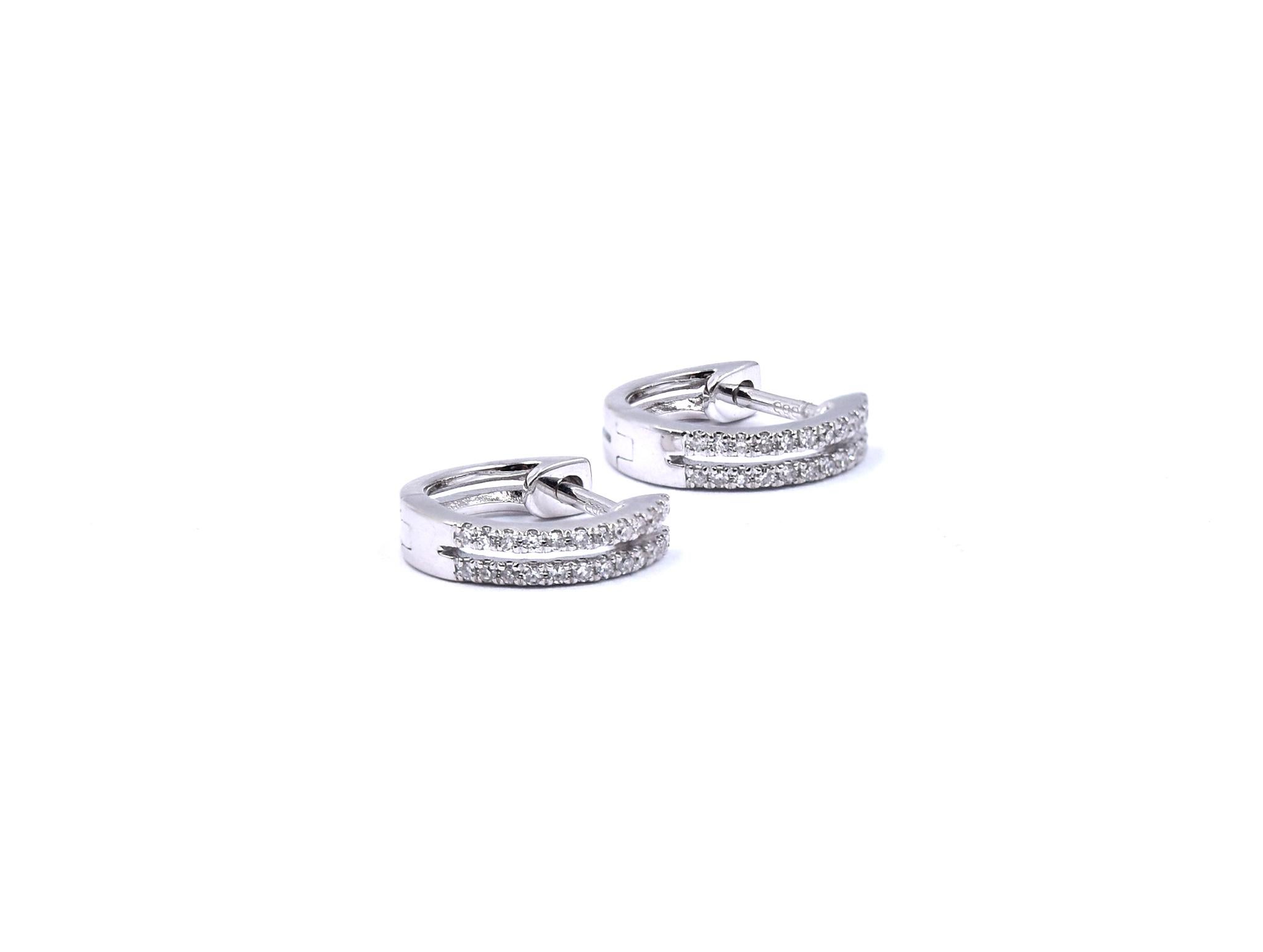 Material: 14K white gold
Diamonds: 48 single cut = .12cttw
Color: H
Clarity: I1
Dimensions: earrings measure 11.8 X 2.66mm
Fastenings: snap closure
Weight: 2.0 grams
