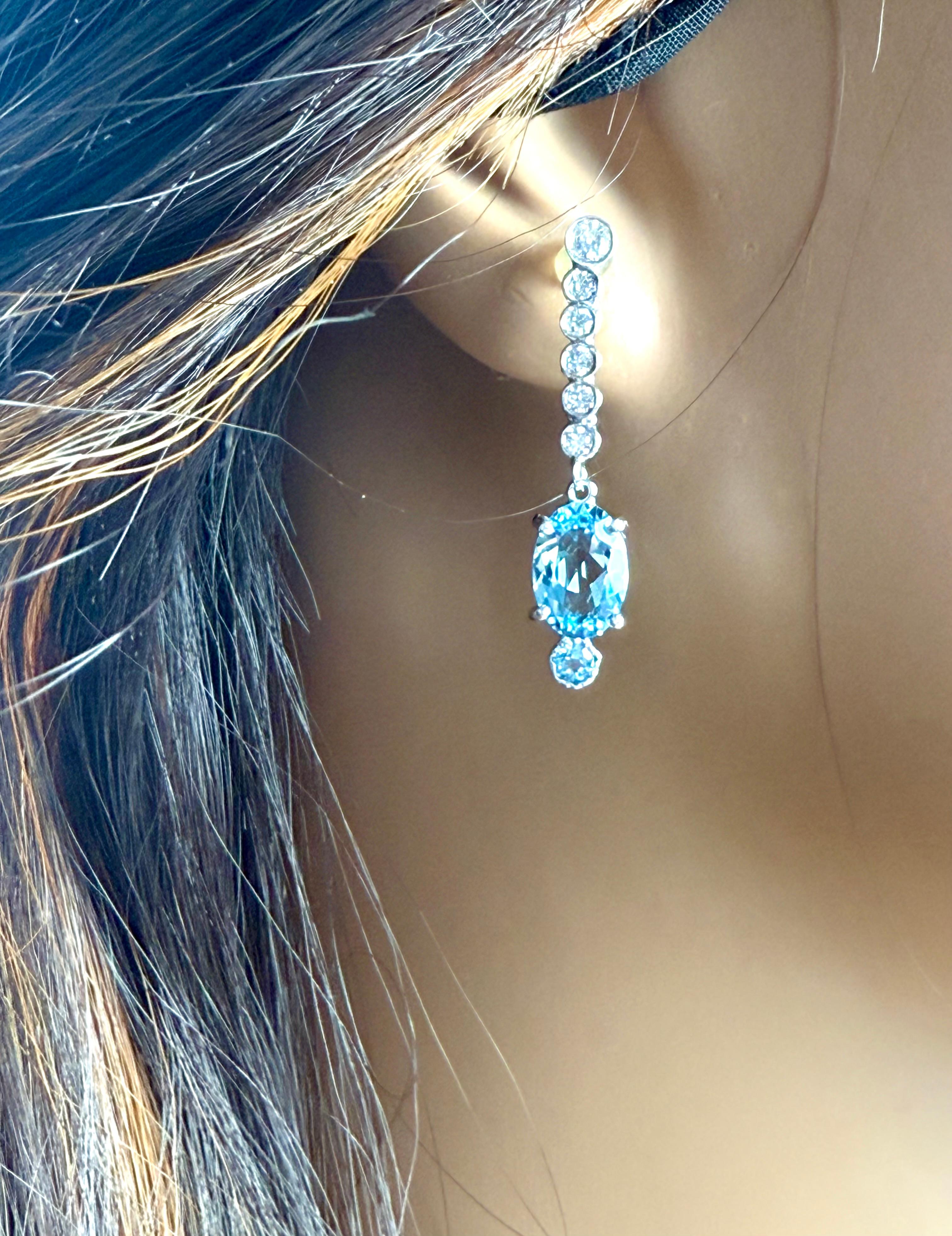 Indulge in the mesmerizing allure of the ocean with these breathtaking 14KW Natural Santa Maria Blue Aquamarine 14 Karat White Gold Drop Earrings. Earring features a stunning 3.07-carat Santa Maria Blue Aquamarine, meticulously cut into a