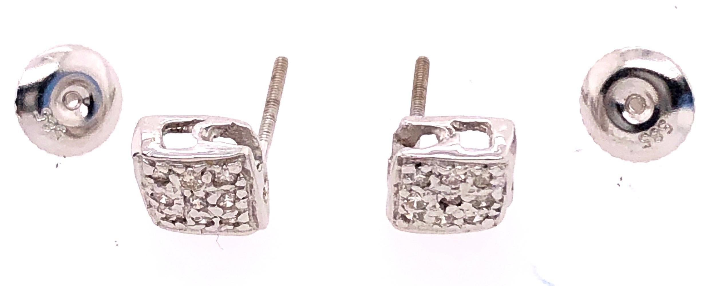 14 Karat White Gold Earrings with Round Diamonds 0.20 Total Diamond Weight.
1.64 grams total weight.