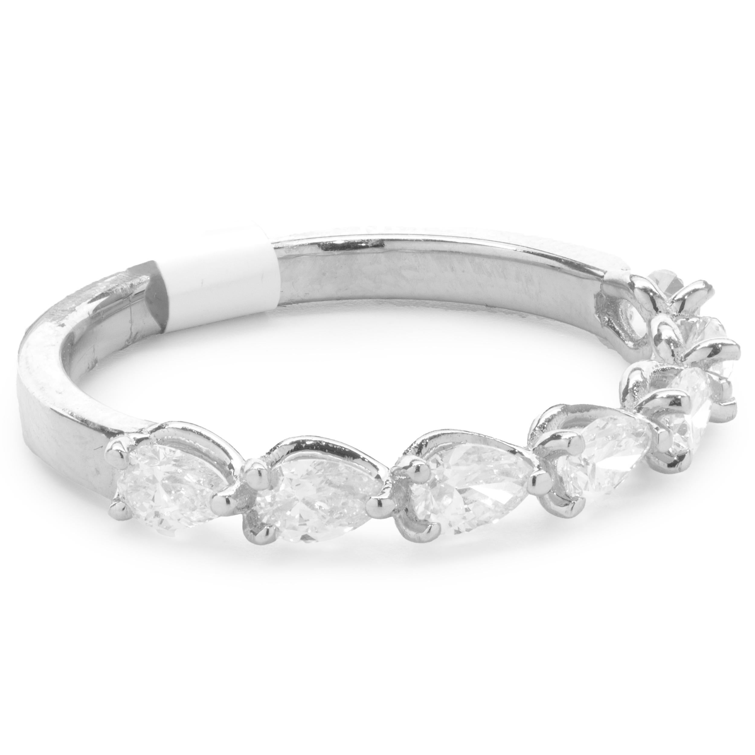 Designer: custom
Material: 14K white gold
Diamond: 7 pear cut = 0.74cttw
Color: G
Clarity: VS1
Size: 7 complimentary sizing available 
Weight: 2.35 grams