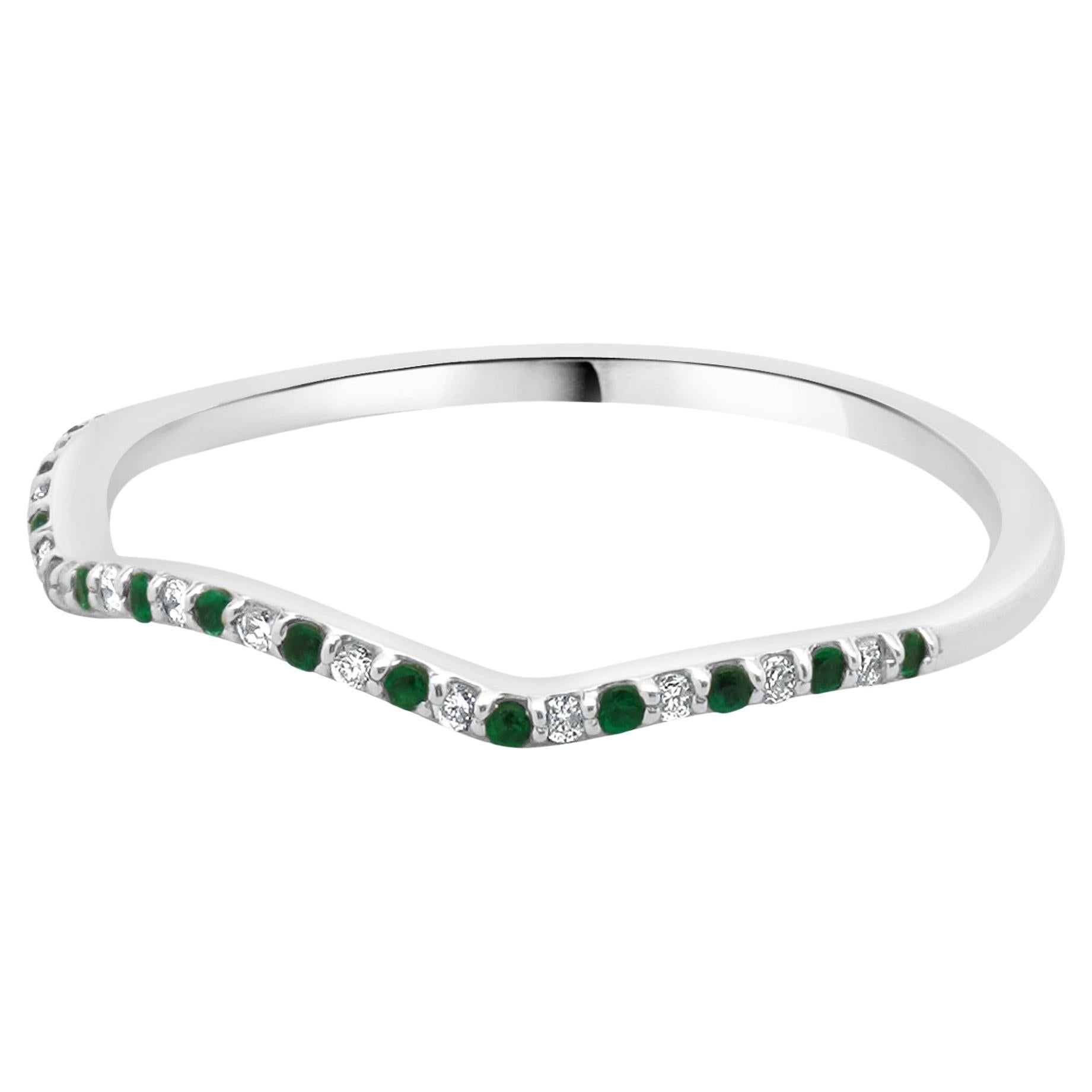 Designer: custom
Material: 14K white gold
Diamond: round brilliant cut = 0.07cttw
Color: F/G
Clarity: VS2-SI1
Emerald: round cut = 0.06cttw
Ring Size: 9.25 (please allow two extra shipping days for sizing requests) 
Weight: 1.45 grams