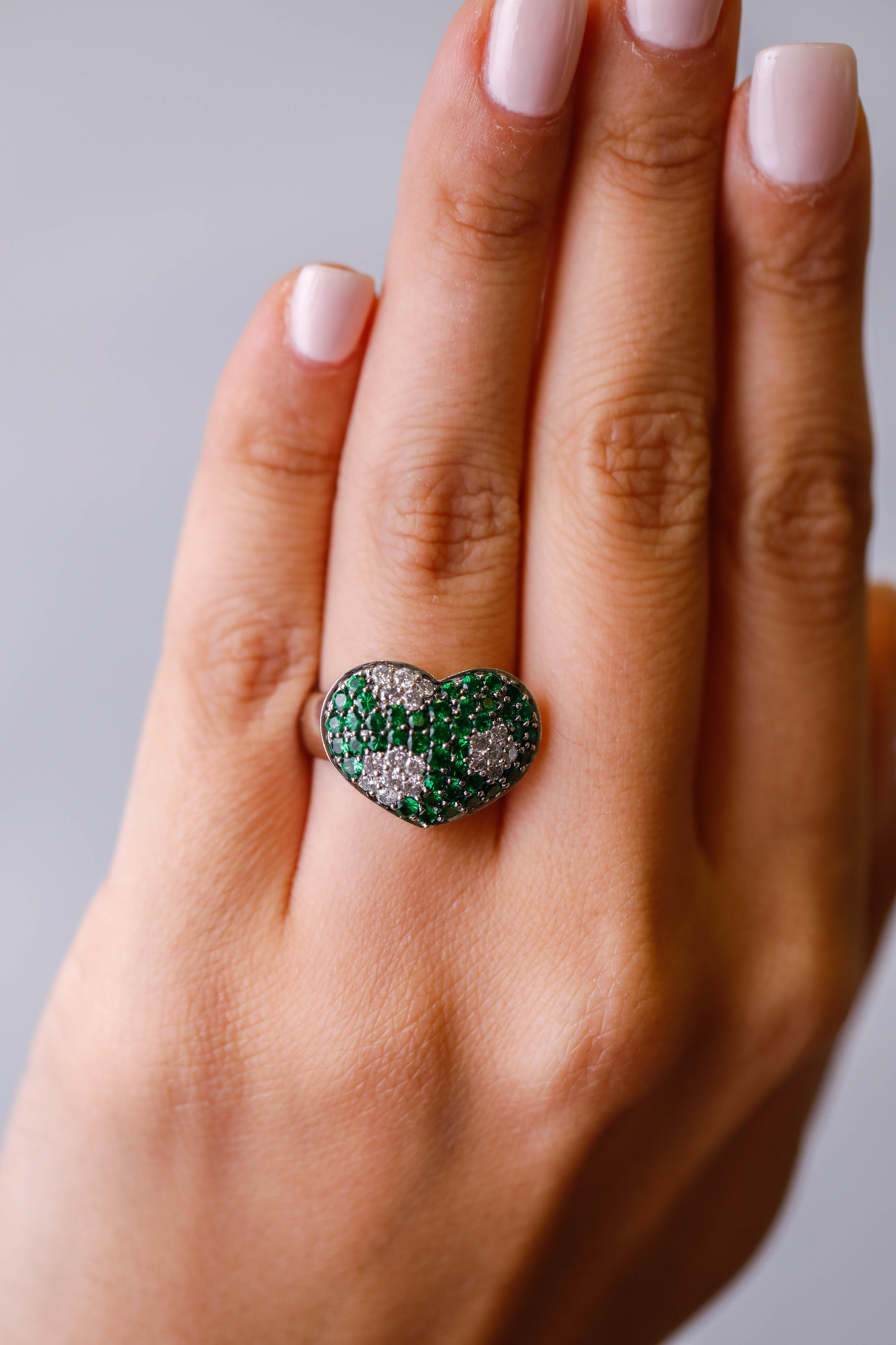 14 Karat White Gold green sapphire and Diamond Designer Heart Shape Ring Jewelry 

What a gem! The perfect cocktail ring showcases green sapphires and accented with shimmering round diamonds. Polished to a brilliant shine. a unique addition to your