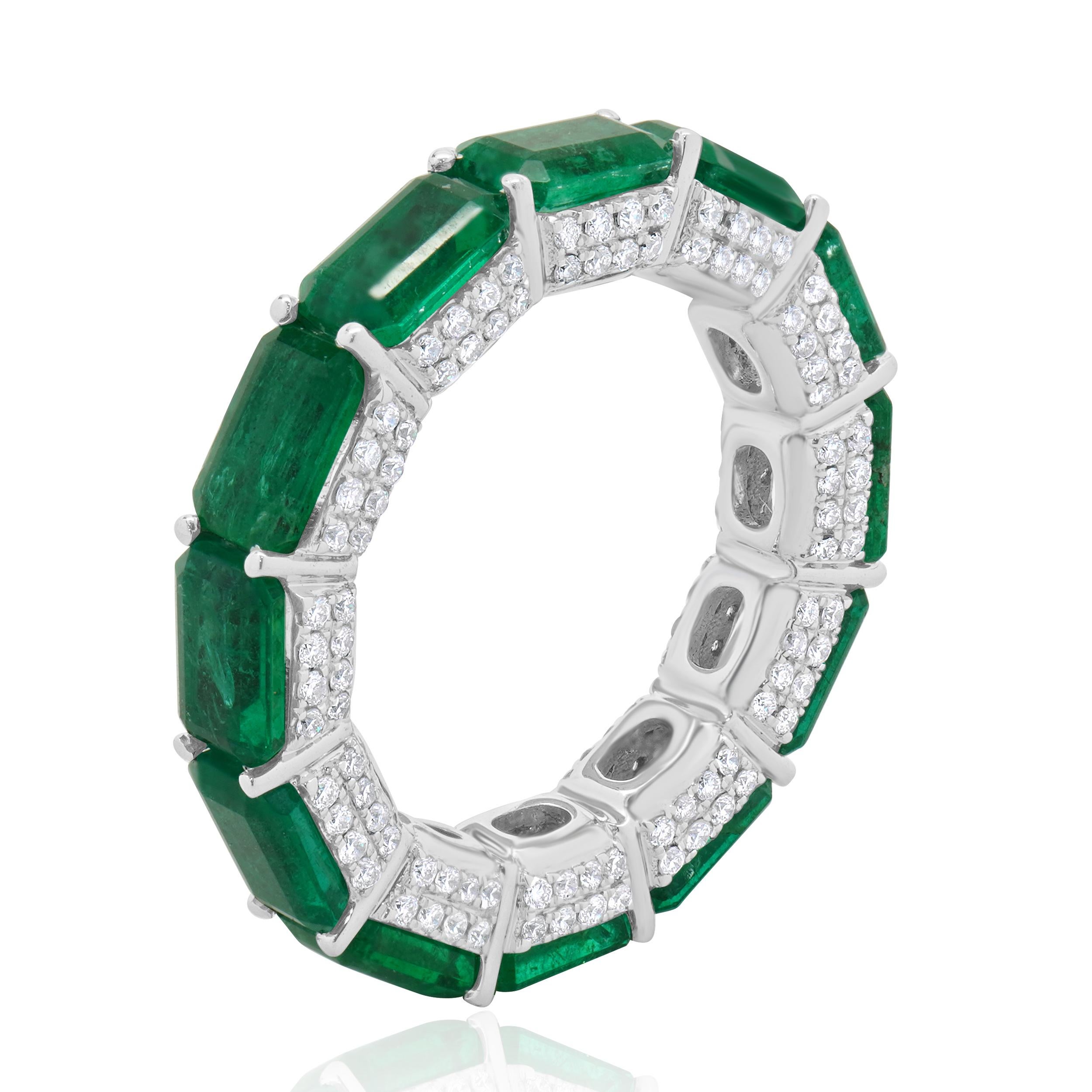 Designer: custom
Material: 14K white gold
Diamond:  round brilliant cut = 0.81cttw
Color: G
Clarity: SI1
Emeralds: 6.49cttw
Ring Size: 6.5 (please allow two extra shipping days for sizing requests) 
Weight: 5.56 grams
