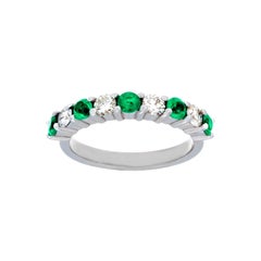 14 Karat White Gold Emerald and Diamond Part Way Band Ring 14 Karat White Gold Emerald and Diamond Part Way Band Ring