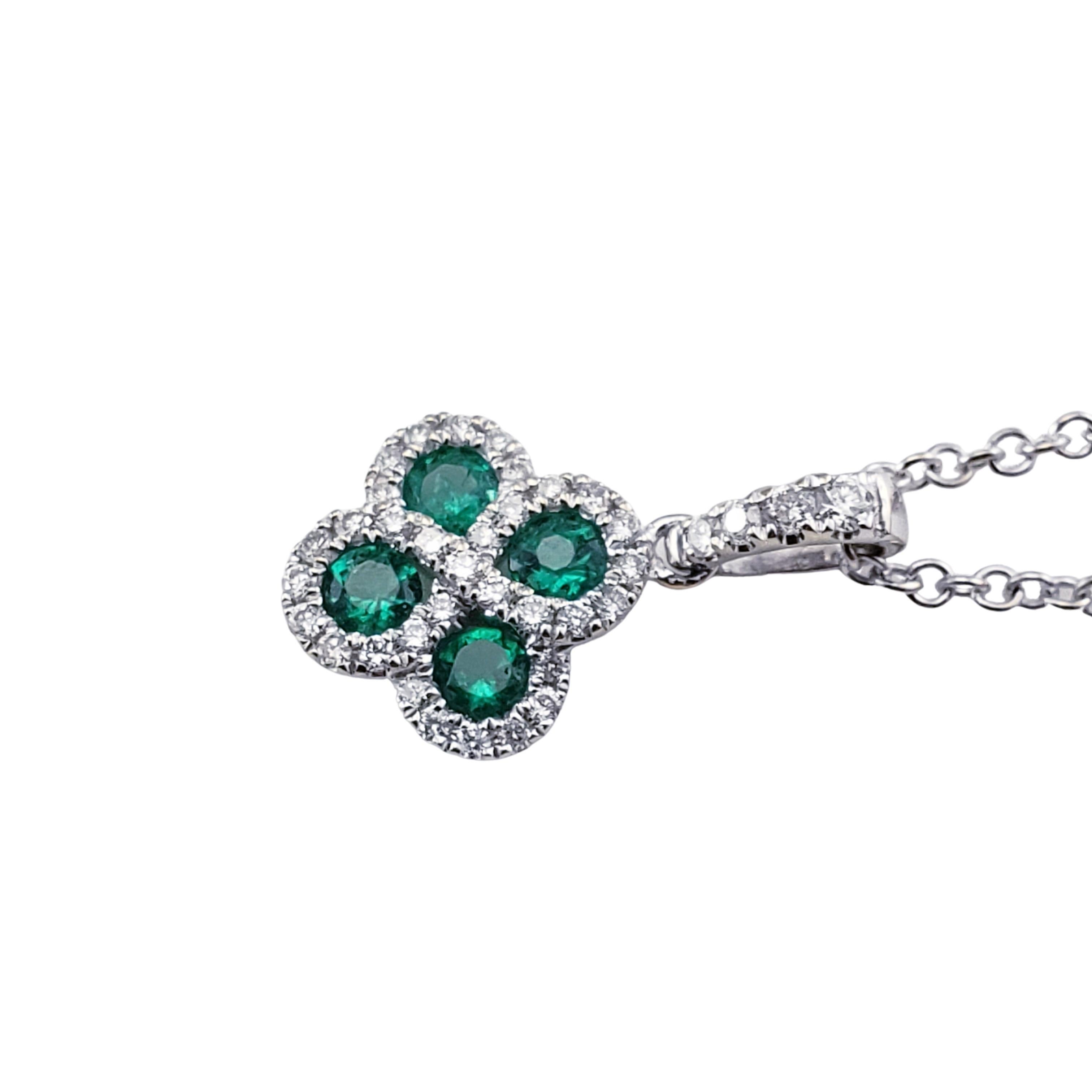 14 Karat White Gold Lab Created Emerald and Diamond Pendant Necklace-

This lovely pendant features four round emeralds and 33 round brilliant cut diamonds set in  14K white gold.  Suspends from a classic white gold cable chain.

Approximate diamond