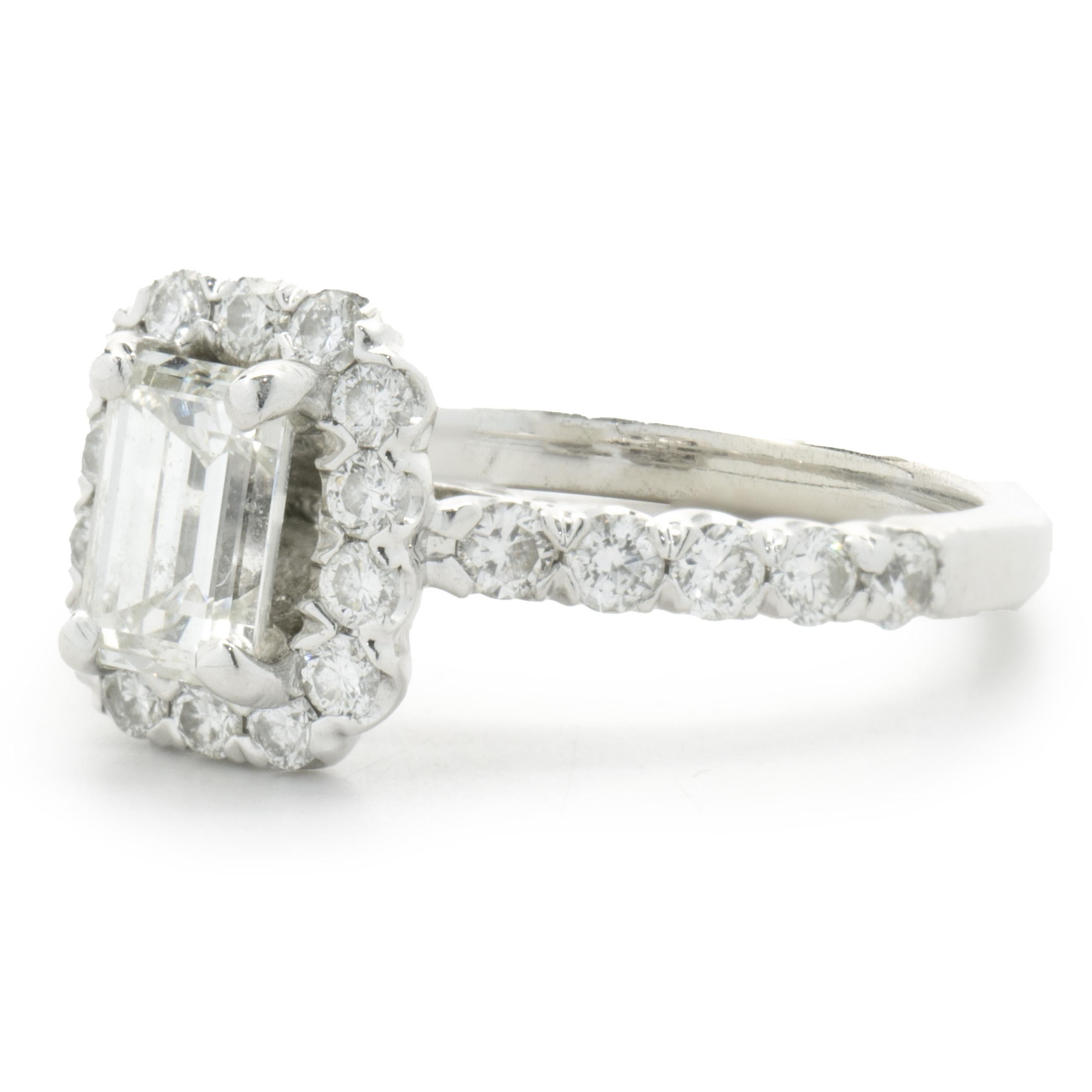 Designer: Custom
Material: 14K white gold
Center Diamond: 1 emerald cut = 0.50cttw
Color: J
Clarity: SI1
Diamond: 52 round brilliant cut = 0.60cttw
Color: H
Clarity: SI1-2
Dimensions: ring top measures 9.9mm wide
Ring Size: 6.5 (complimentary sizing