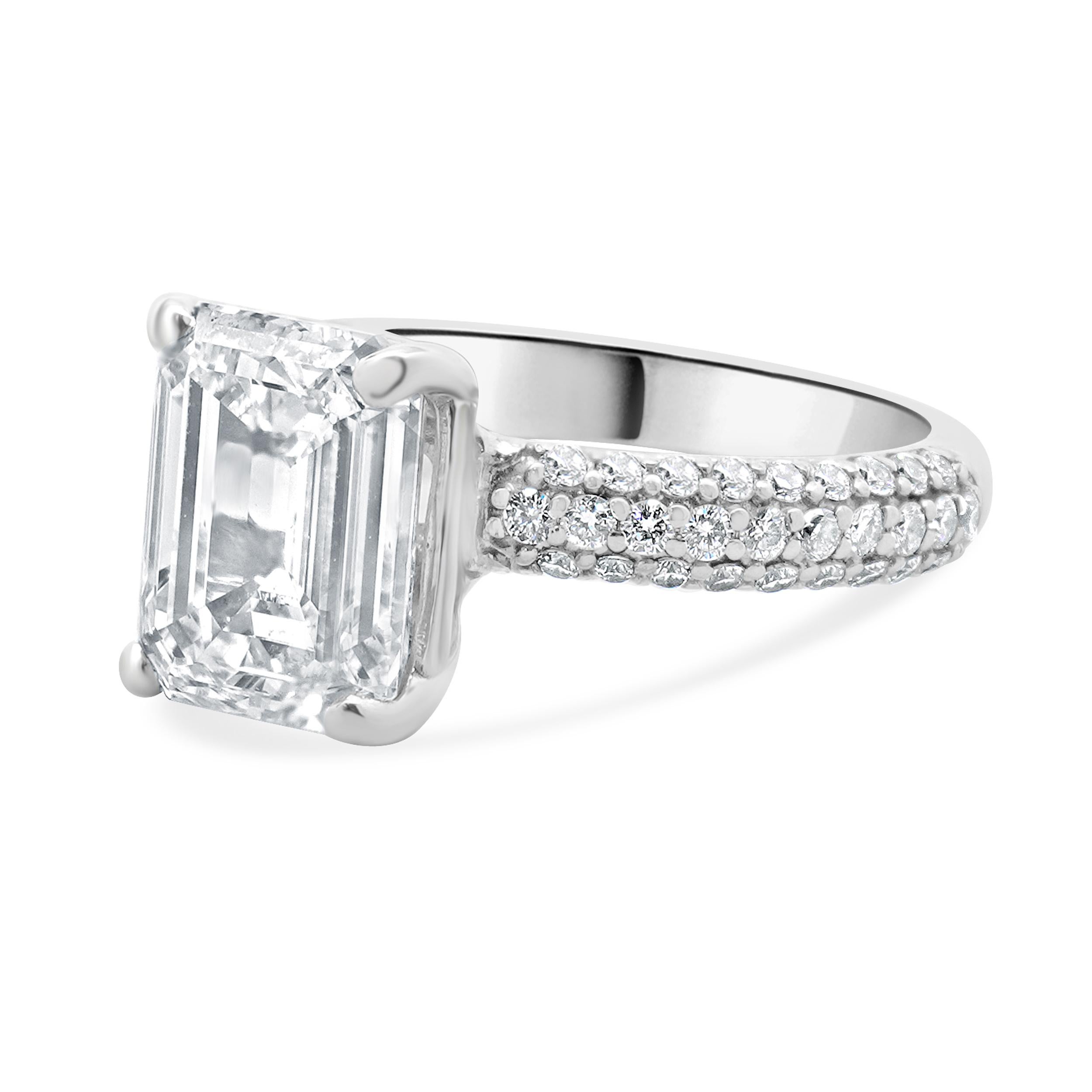 Designer: custom design
Material: 14K white gold
Center Diamond: 1 emerald cut = 4.02ct
Color : F
Clarity : VS2
GIA: 620789134
Diamond: 56 round brilliant cut = 0.56cttw
Color : G
Clarity : VS2
Dimensions: ring top measures 20mm
Size: 5.75