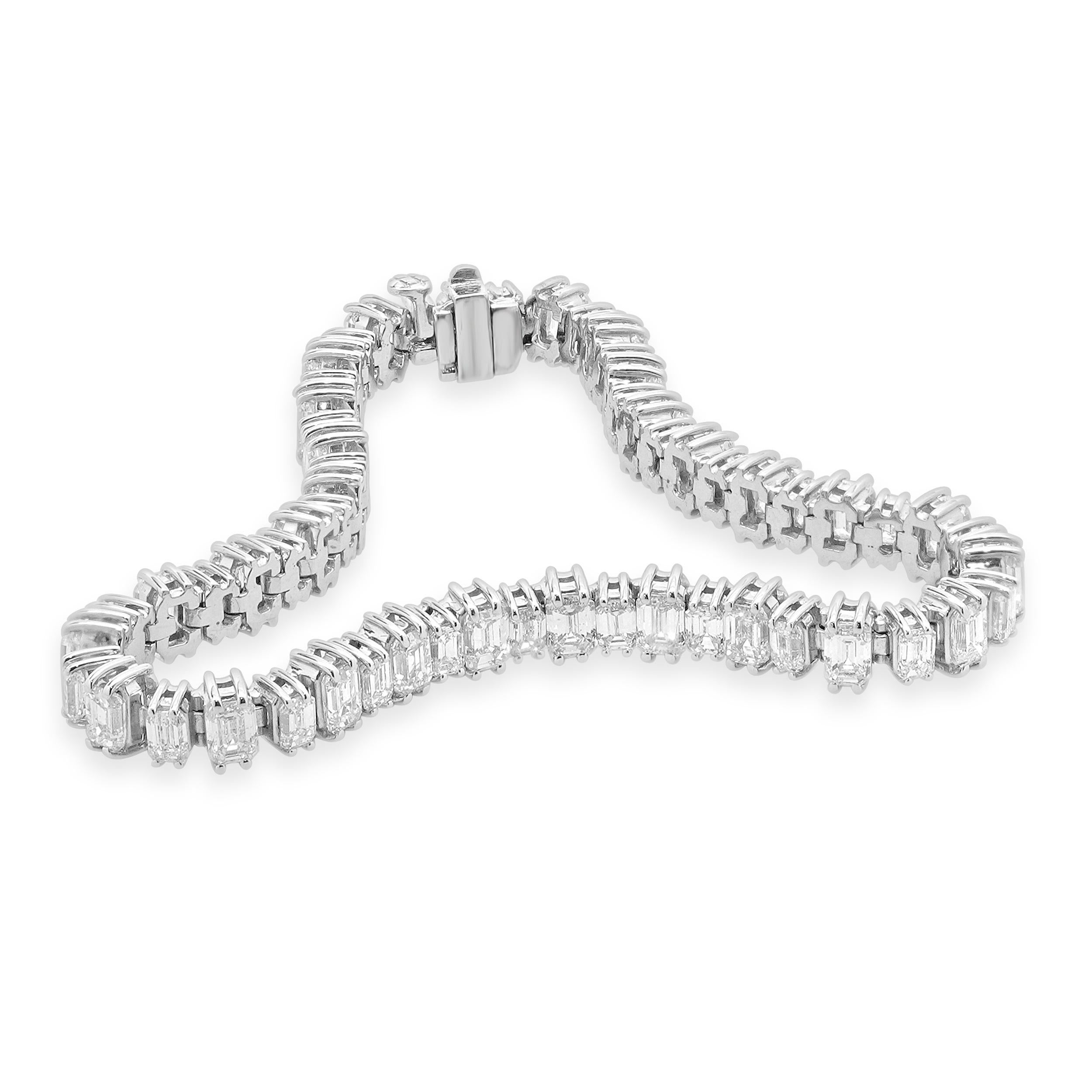 Designer: custom design
Material: 14K white Gold
Diamond: 58 emerald cut= 10.87cttw
Color: G/H
Clarity: VS-SI1
Dimensions: bracelet will fit up to a 7-inch wrist
Weight: 17.65 grams
