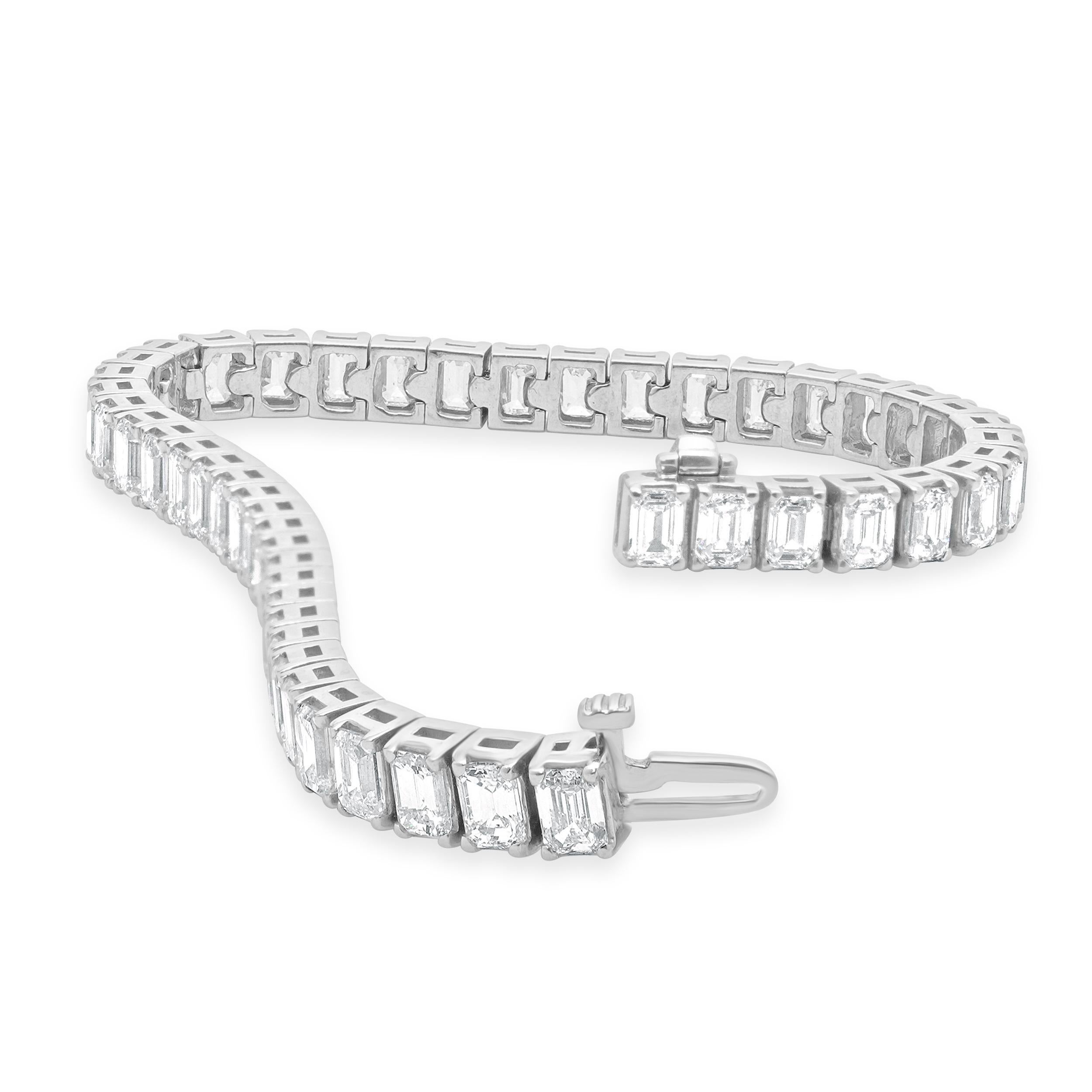 Designer: custom design
Material: 14K white gold
Diamonds: emerald cut = 14.23cttw
Color: I
Clarity: SI1
Dimensions: bracelet will fit up to a 7 -inch wrist
Weight: 20.23 grams