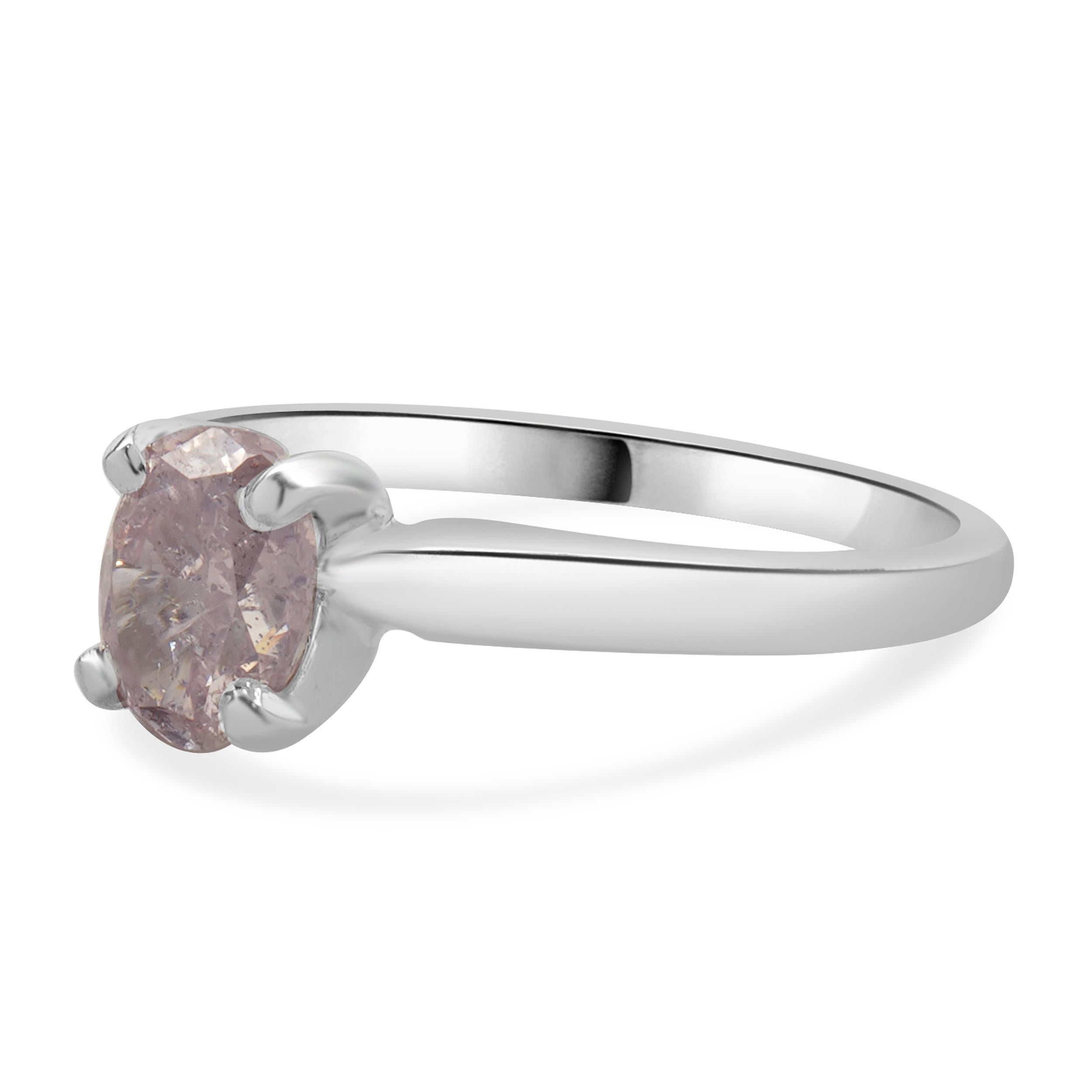 Designer: Custom
Material: 14K white gold
Diamond: 1 oval cut = 1.05ct
Color: Purplish - pink
Clarity: I1
GIA: 14323561
Dimensions: ring top measures 6.80mm wide
Ring Size: 6.5 (complimentary sizing available)
Weight: 2.52 grams

