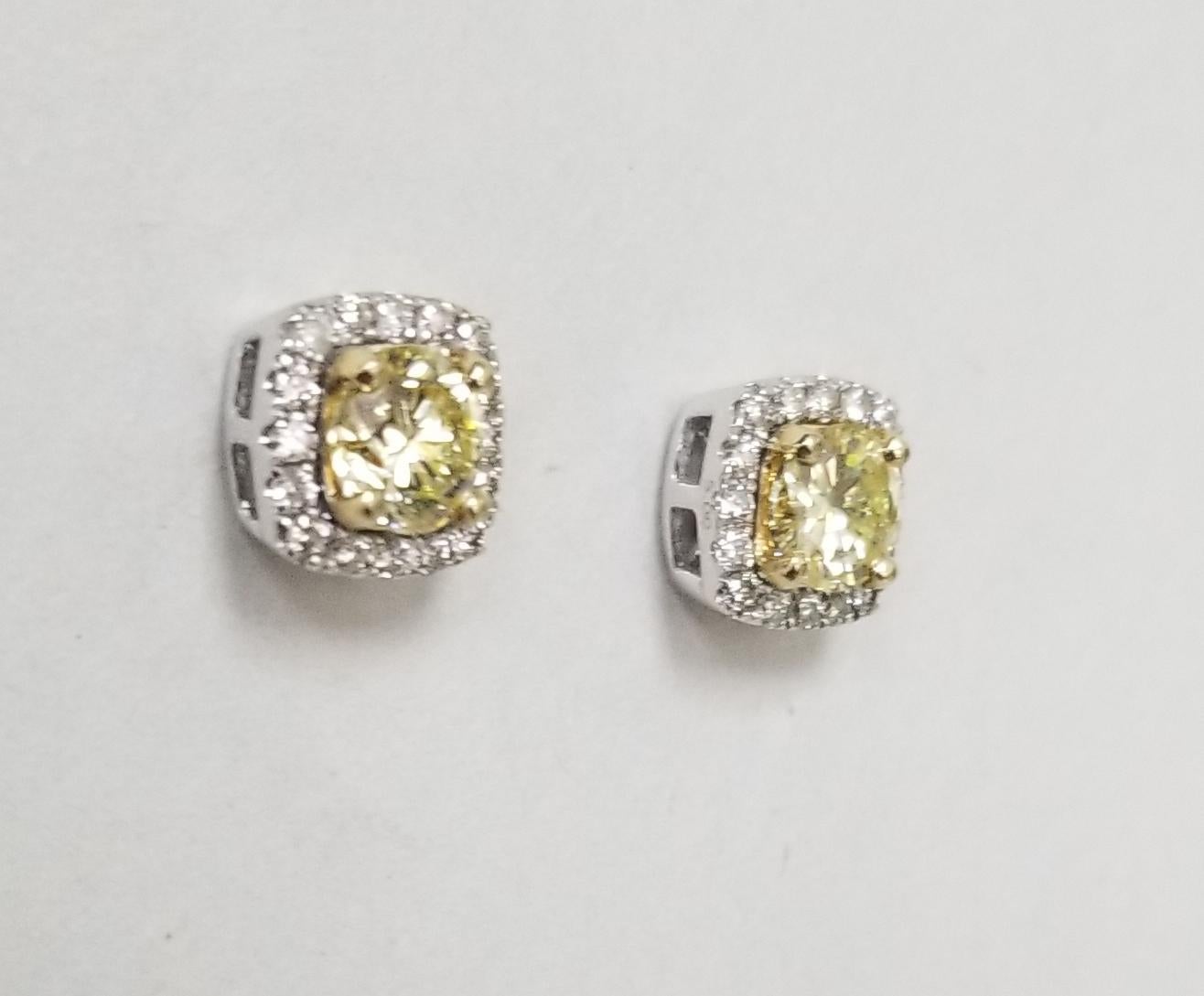 1 Pair of 14k white gold 2 round EGL diamonds; color
