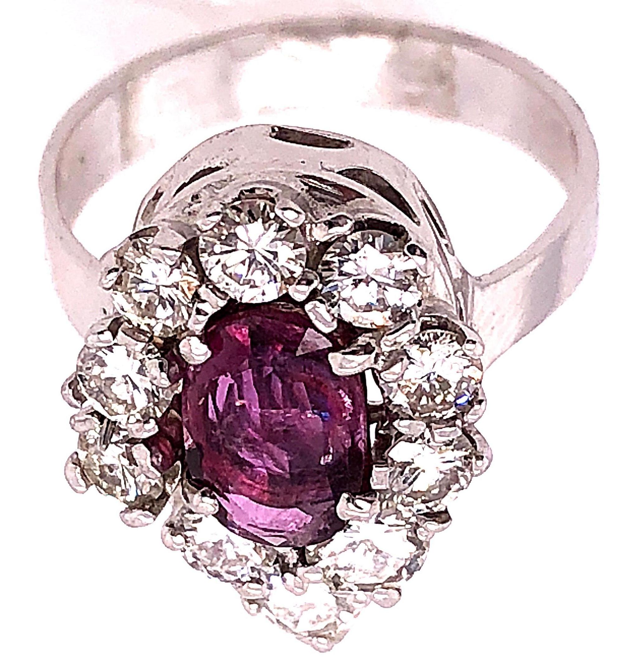 Round Cut 14 Karat White Gold Fashion Oval Ruby Solitaire Ring with Encircling Diamonds For Sale