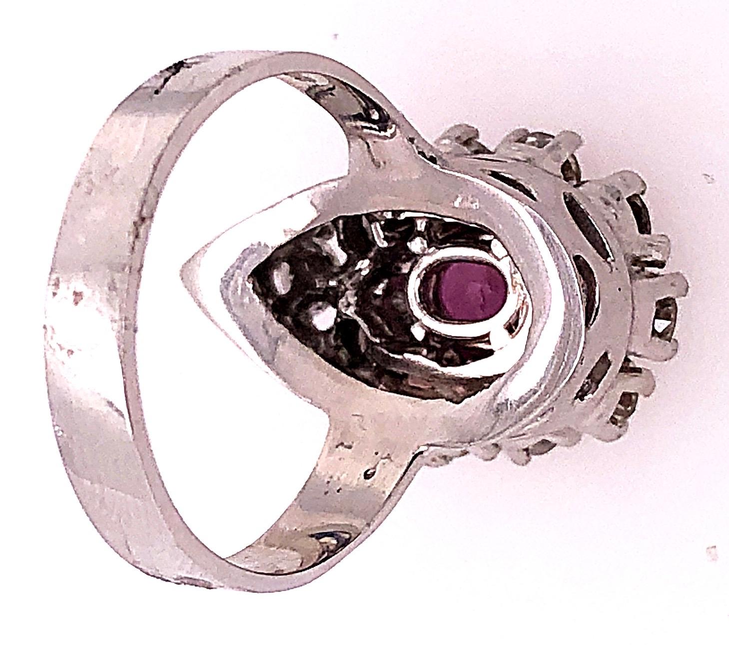 14 Karat White Gold Fashion Oval Ruby Solitaire Ring with Encircling Diamonds For Sale 1