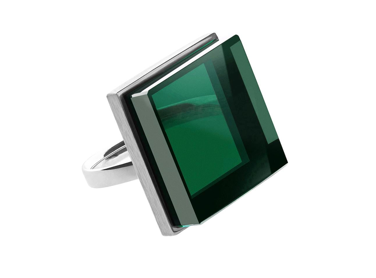 This contemporary fashion ring features a 20x20x6 mm green grown quartz set in 14 karat white gold. It has been featured in Harper's Bazaar and Vogue UA.

The ring has an art deco feel and is suitable for both women and men. Its unique cut allows