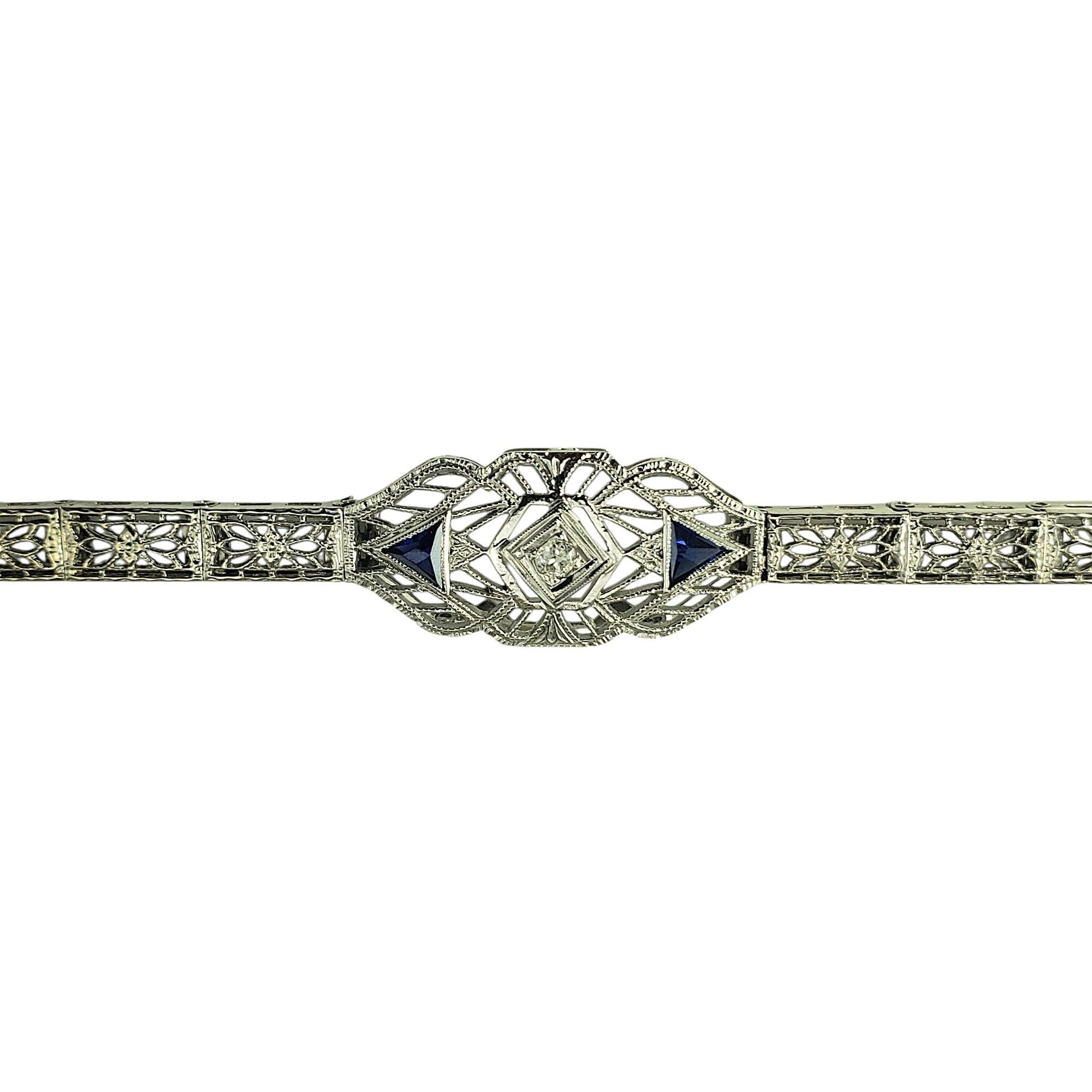 14 Karat White Gold and Diamond Filigree Bracelet-

A sophisticated piece with vintage flair, this elegant 14K white gold bracelet features a stunning filigree design that reflects the charm of the Art Deco era. At its center is one round cut
