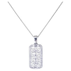 Pendentif filigrane en or blanc 14 carats et diamants n° 19458