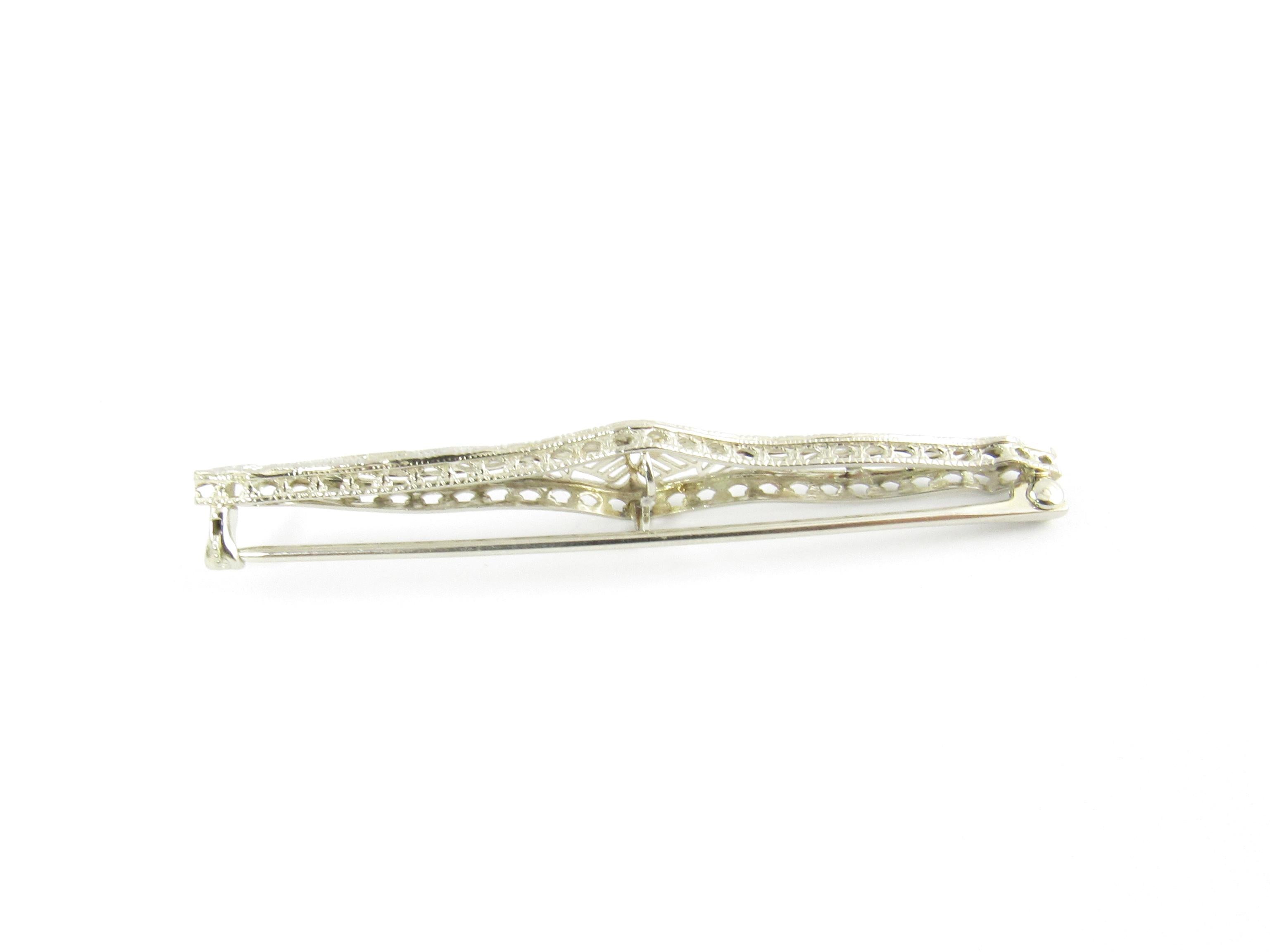 Vintage 14 Karat White Gold Filigree Bar Pin

This elegant bar pin is crafted in beautifully detailed white gold filigree.

Size: 59 mm x 9 mm

Weight: 2.2 dwt. / 3.5 gr.

Stamped: 14K

Very good condition, professionally polished. Will come
