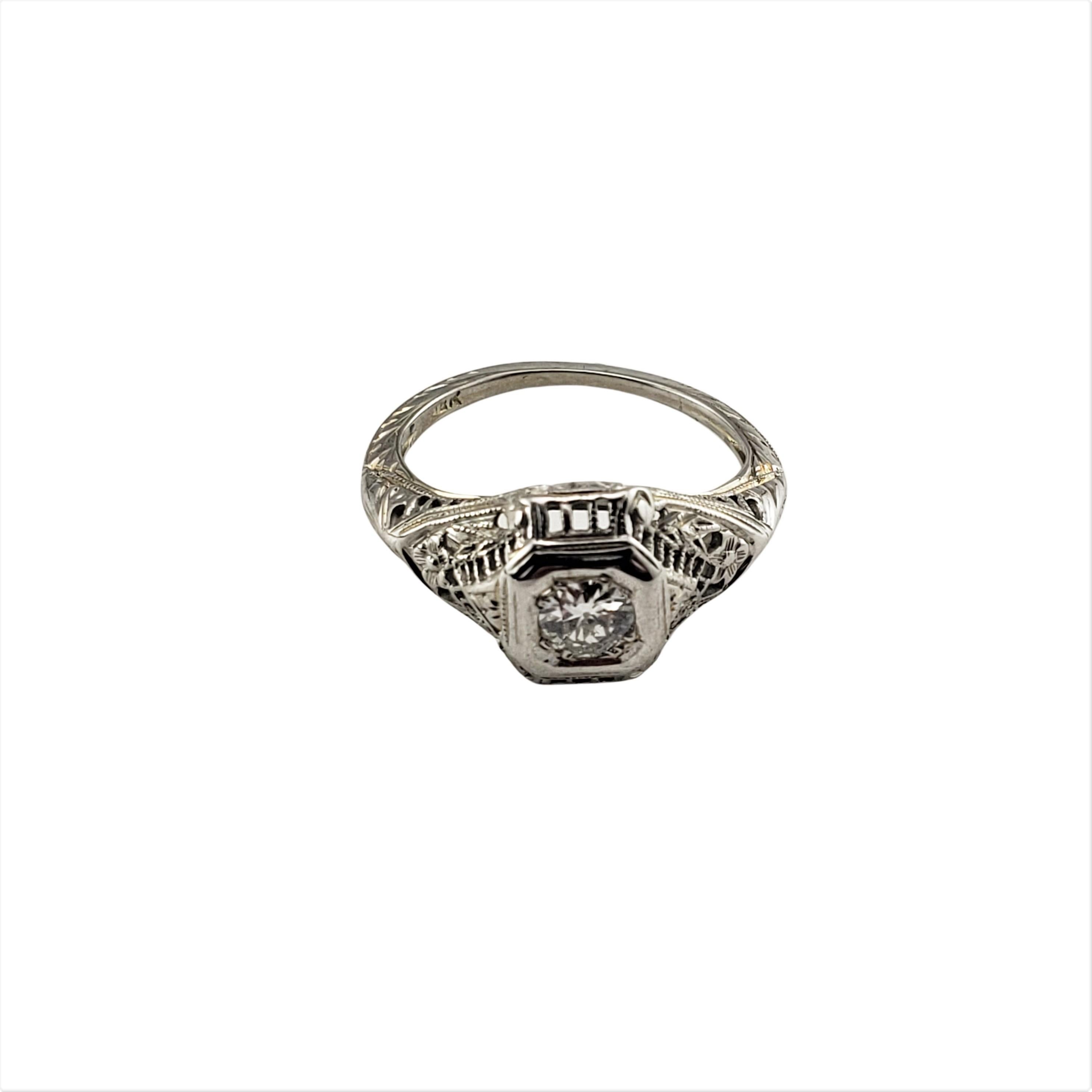 14 Karat White Gold Filigree Diamond Ring Size 4.75-

This stunning ring features one round brilliant cut diamond set in beautifully detailed white gold filigree.  Shank: 1 mm.  
Width: 10 mm.

Approximate total diamond weight:  .35 ct.

Diamond