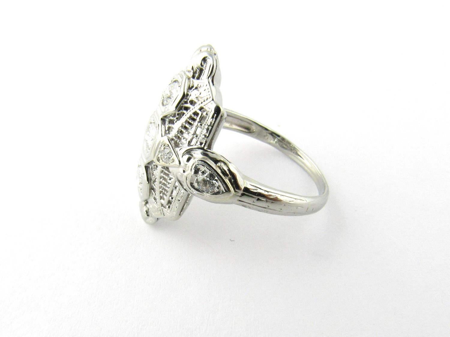 Vintage 14K White Gold Filigree Ring. 

Ring Size 7. 

This beautiful ring is the perfect accessory for that special evening out. 

The front of the ring measures approx 9 mm x 4 mm x 20 mm. 

The shank measures approx 2 mm. 

1 European cut