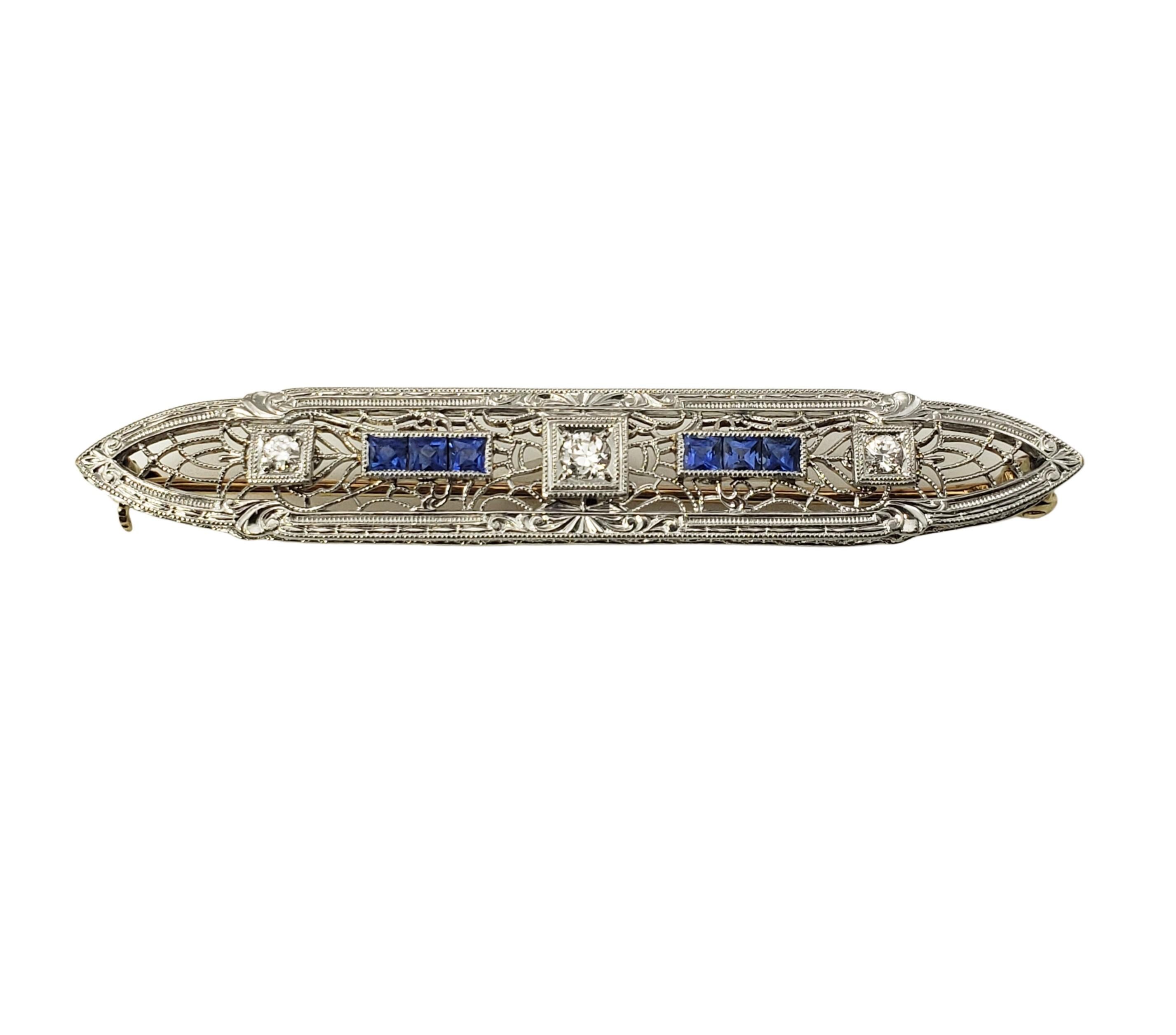14 Karat White Gold Filigree Synthetic Sapphire and Diamond Bar Pin-

This stunning pin features six square tested synthetic sapphires and one round brilliant cut diamond set in beautifully detailed white gold filigree.

Approximate total diamond