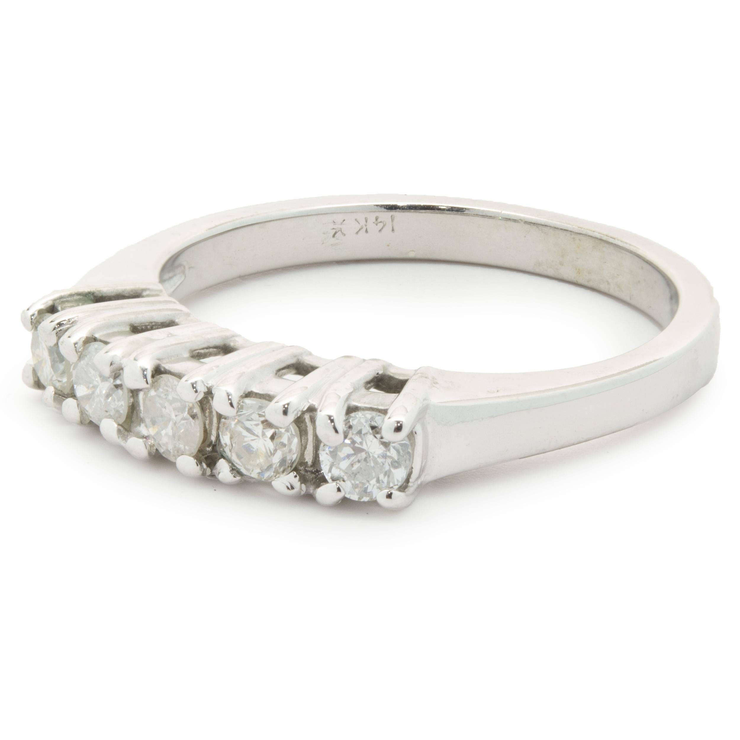 Designer: custom
Material: 14K white gold
Diamond: 5 round brilliant cut = 0.40cttw
Color: H
Clarity: SI2
Size: 5.5 (complimentary sizing available upon request)
Weight: 2.94 grams
