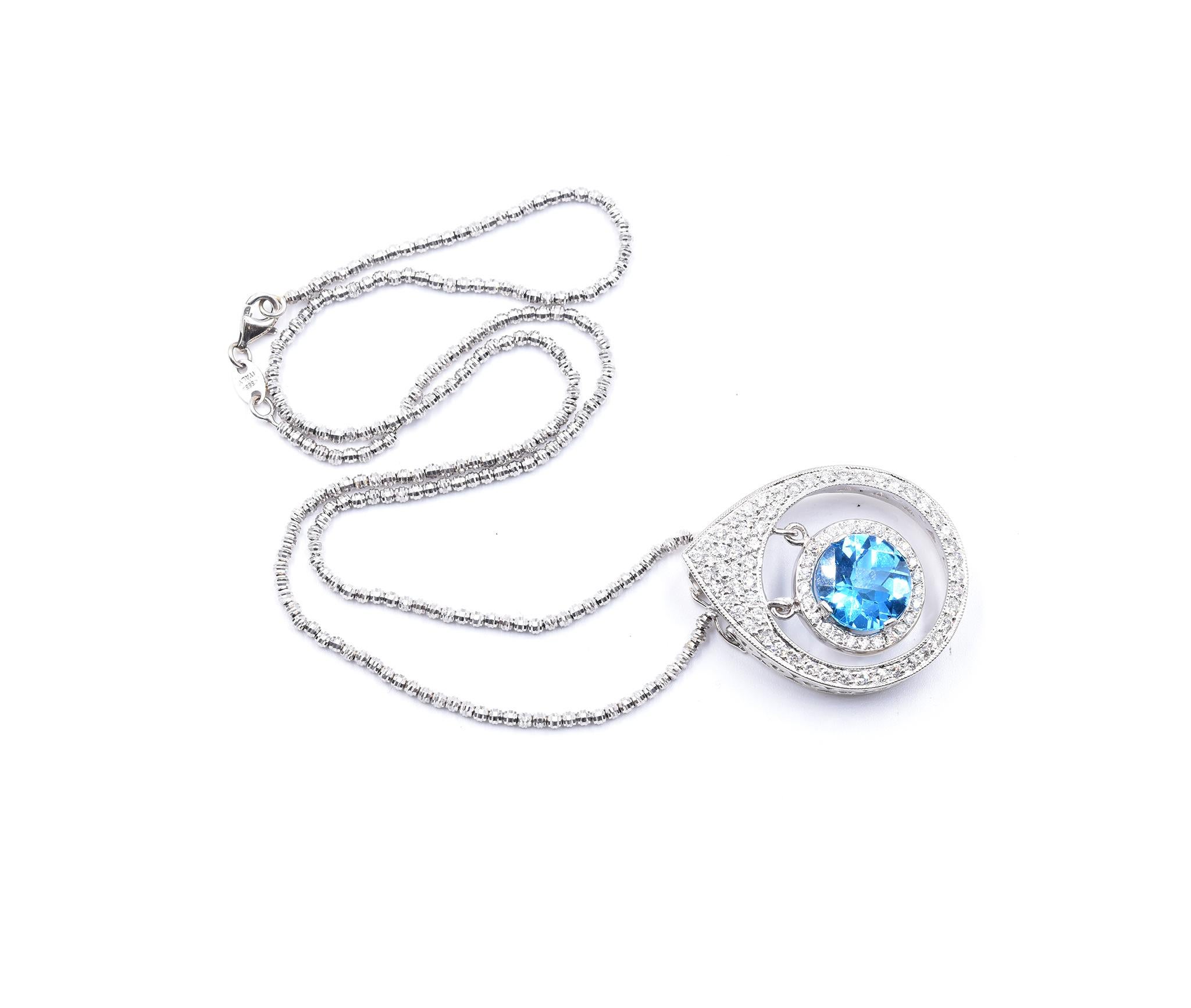 Designer: custom 
Material: 14K white gold
Blue Topaz: 1 round cut = 6.48cttw
Diamond: 80 round cut = 2.40cttw
Color: G
Clarity: SI1
Dimensions: necklace measures 18-inches long 
Weight: 21.78 grams
