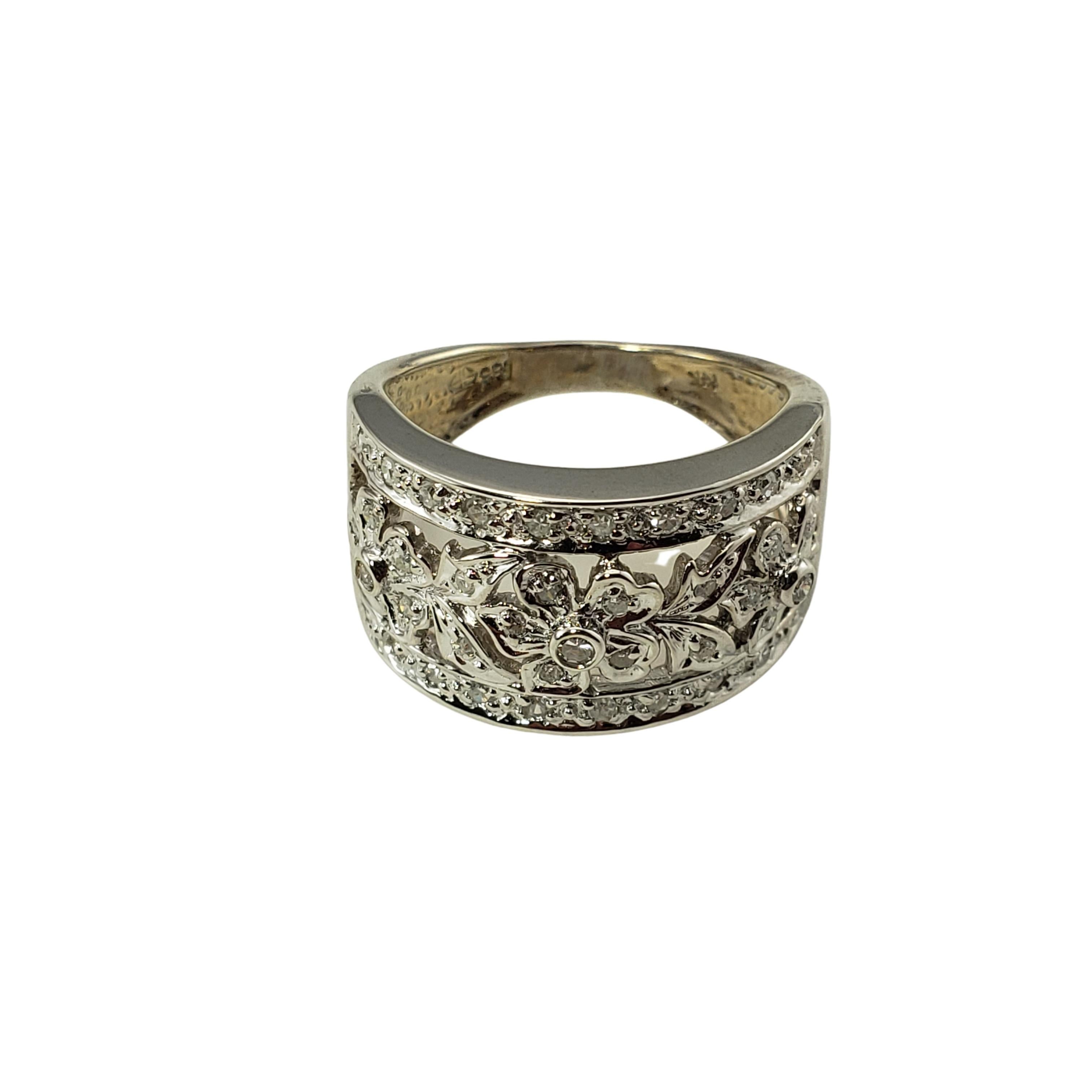 14 Karat White Gold Floral Diamond Ring Size 5.5-

This sparkling floral band features 42 round single cut diamonds set in beautifully detailed 14K white gold.  Width:  12 mm.
Shank:  3 mm.

Approximate total diamond weight:  .45 ct.

Diamond color:
