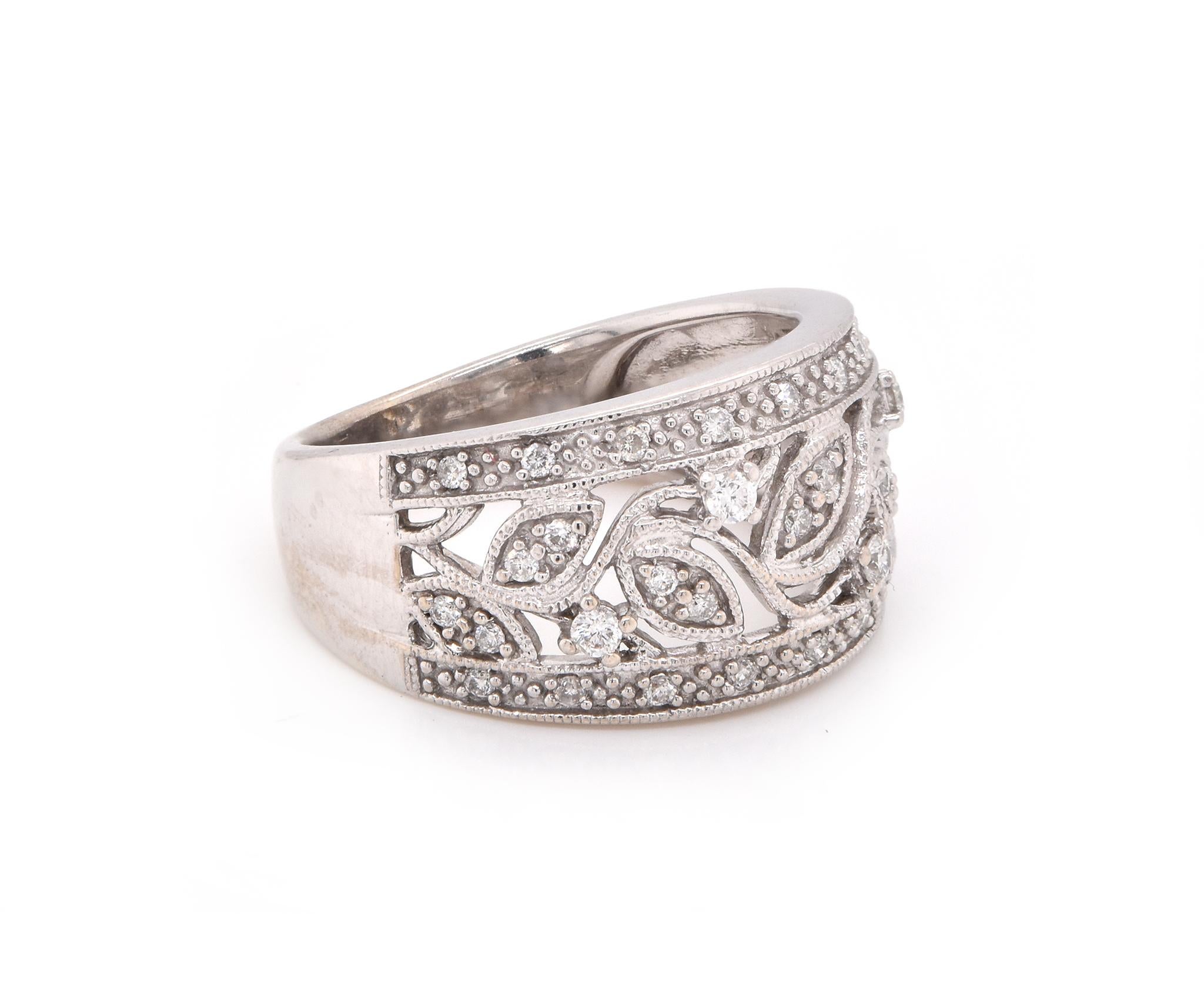 Designer: custom
Material: 14K white gold
Diamonds: 34 round cut = .24cttw
Color: H
Clarity: SI1
Ring size: 6 (please allow two additional shipping days for sizing requests)
Dimensions: ring top is 11.16mm wide 
Weight:  5.3 grams 
